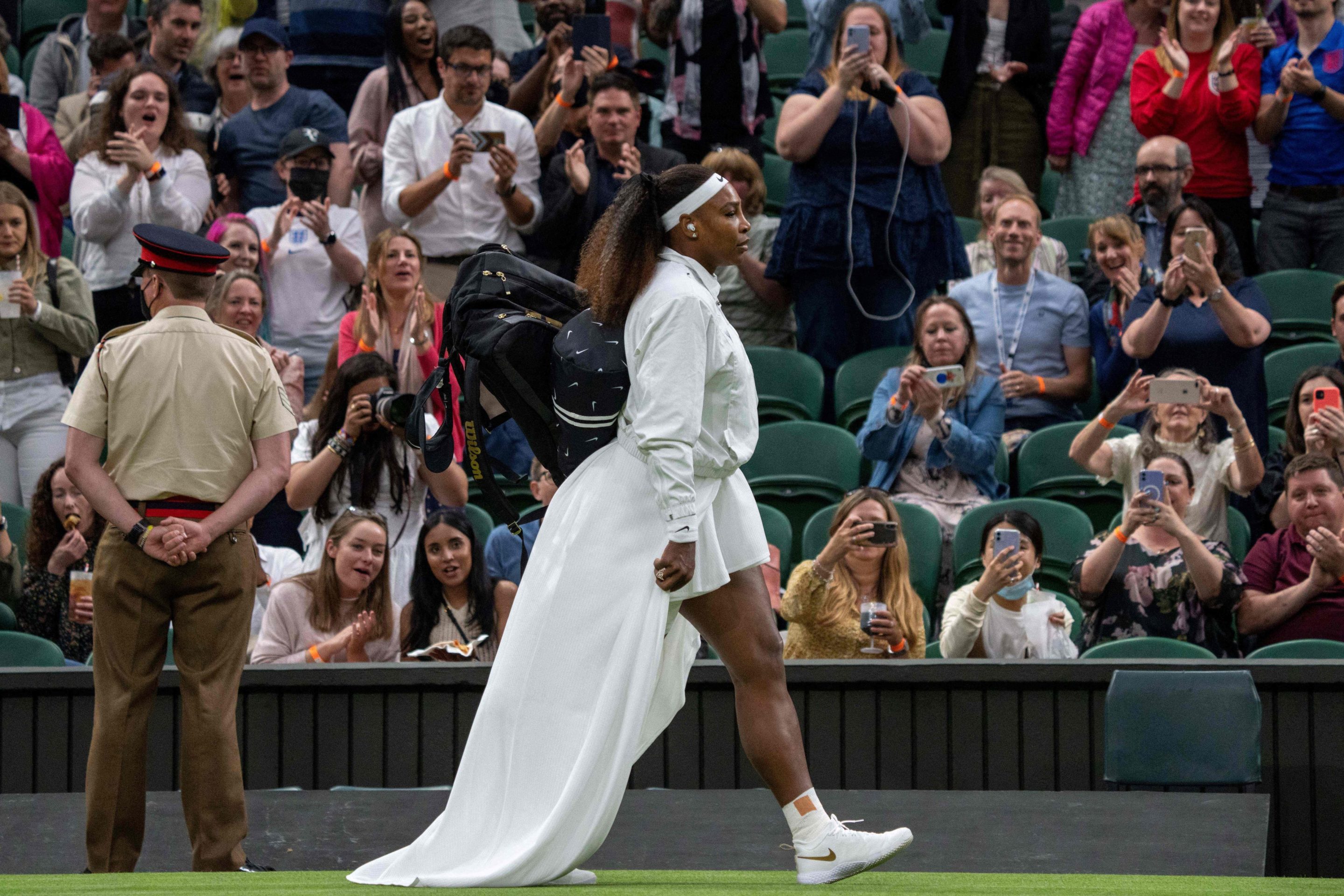 Serena Williams walks onto the court at Wimbledon 2021.