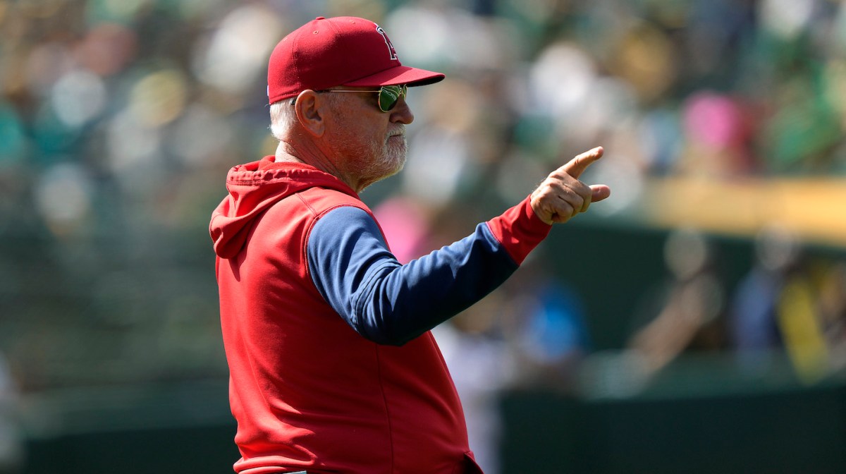 OAKLAND, CALIFORNIA - MAY 15: Manager Joe Maddon #70 of the Los Angeles Angels signals the bullpen to make a pitching change against the Oakland Athletics in the bottom of the seventh inning at RingCentral Coliseum on May 15, 2022 in Oakland, California. (Photo by Thearon W. Henderson/Getty Images)