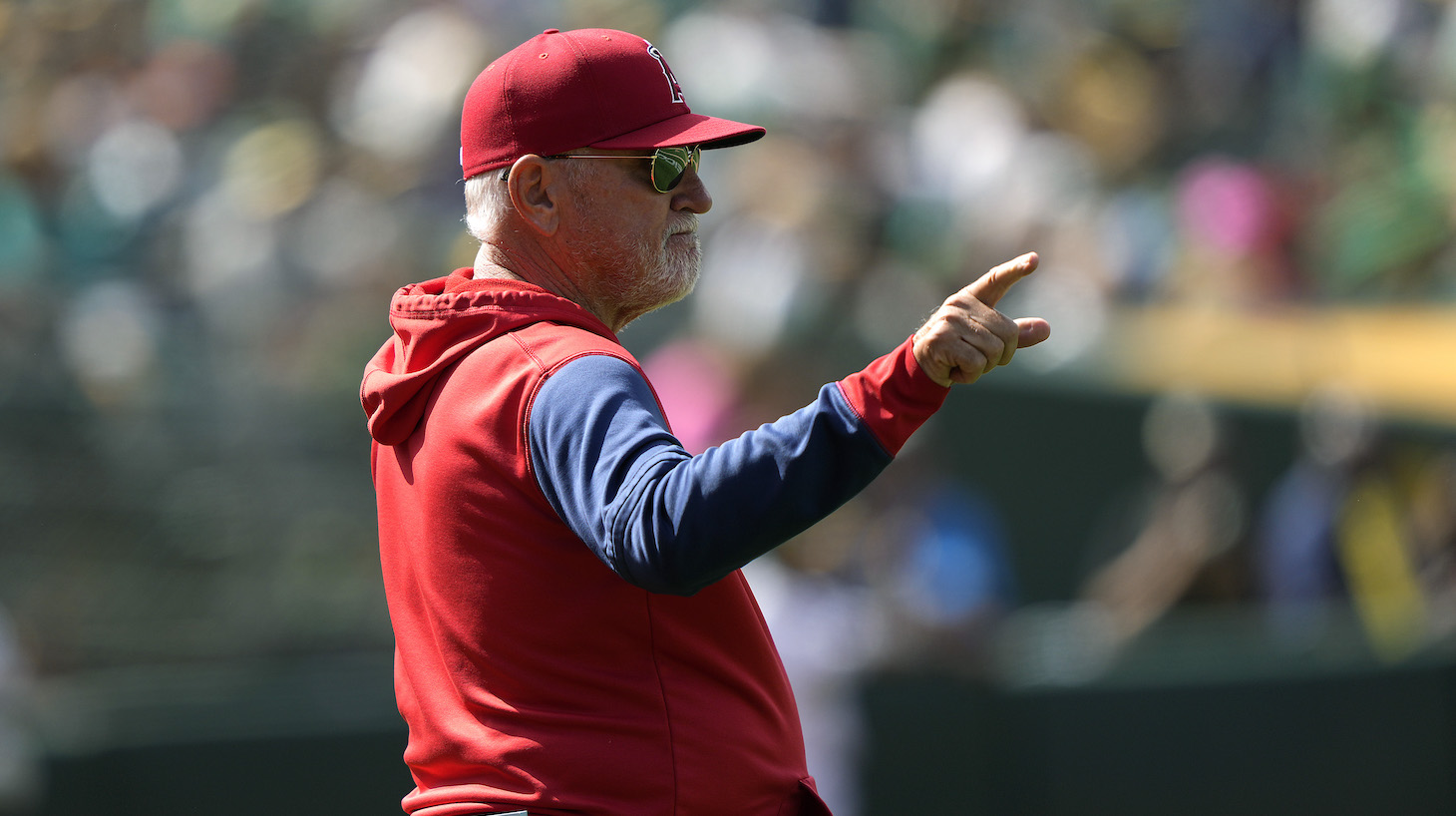 OAKLAND, CALIFORNIA - MAY 15: Manager Joe Maddon #70 of the Los Angeles Angels signals the bullpen to make a pitching change against the Oakland Athletics in the bottom of the seventh inning at RingCentral Coliseum on May 15, 2022 in Oakland, California. (Photo by Thearon W. Henderson/Getty Images)