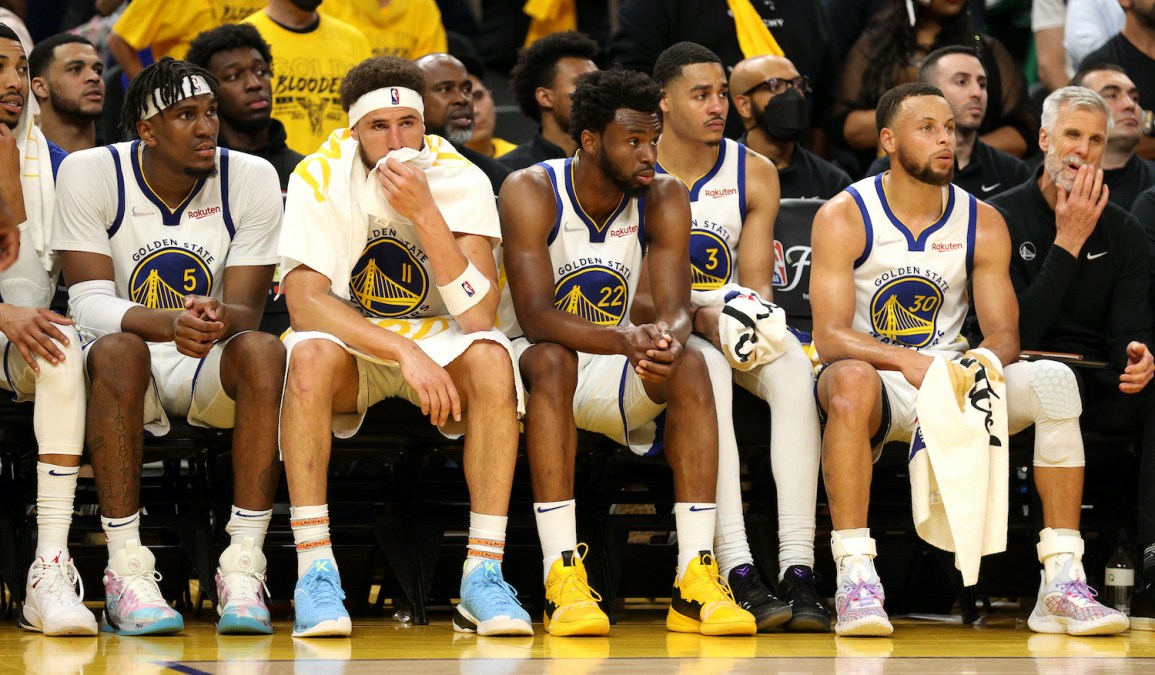 SAN FRANCISCO, CALIFORNIA - JUNE 02: (L to R) Kevon Looney #5, Klay Thompson #11, Andrew Wiggins #22, Jordan Poole #3, and Stephen Curry #30 of the Golden State Warriors look on from the bench during the fourth quarter against the Boston Celtics in Game One of the 2022 NBA Finals at Chase Center on June 02, 2022 in San Francisco, California. NOTE TO USER: User expressly acknowledges and agrees that, by downloading and/or using this photograph, User is consenting to the terms and conditions of the Getty Images License Agreement. (Photo by Ezra Shaw/Getty Images)