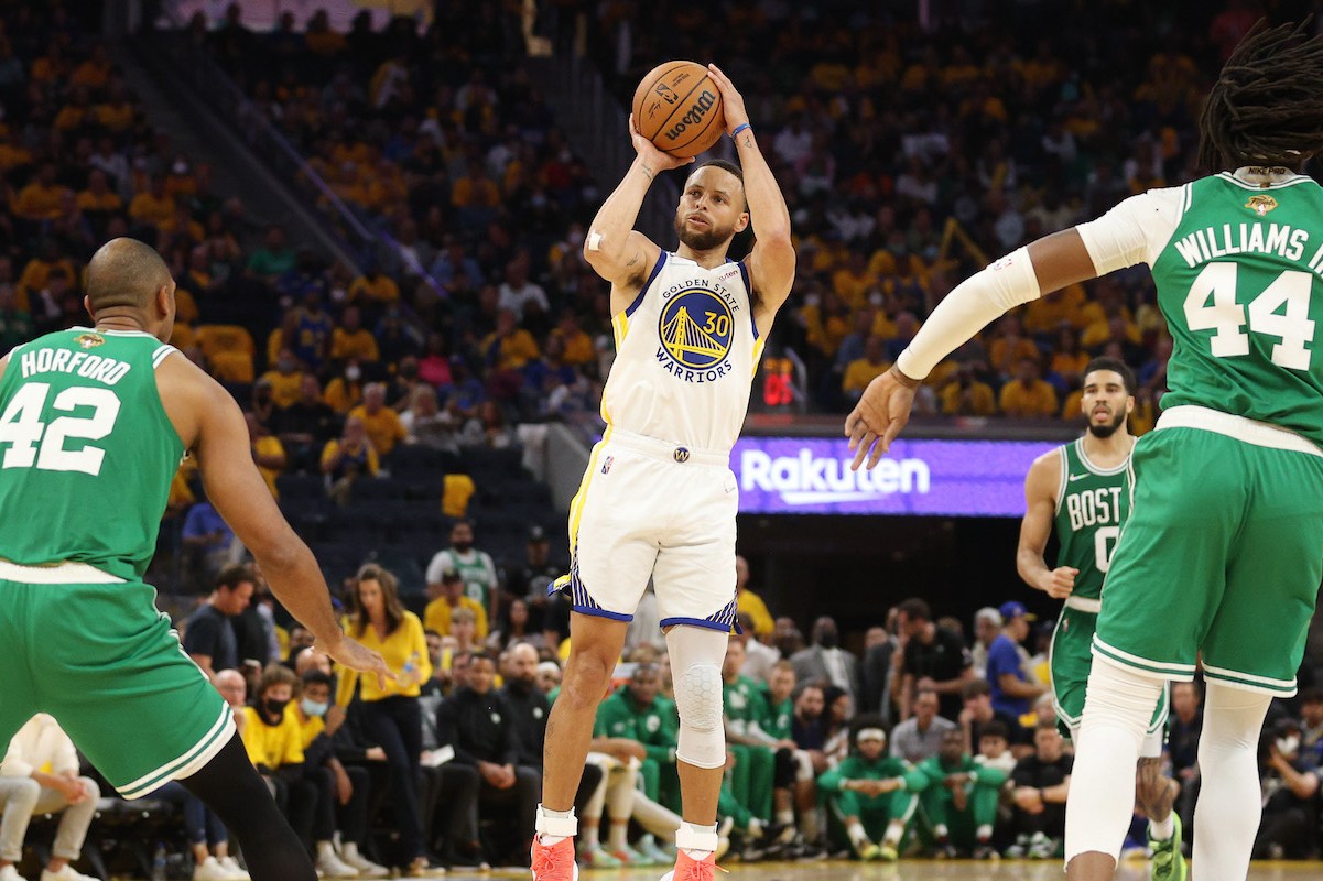 Stephen Curry shoots against Al Horford and Robert Williams in Game 2 of the NBA Finals