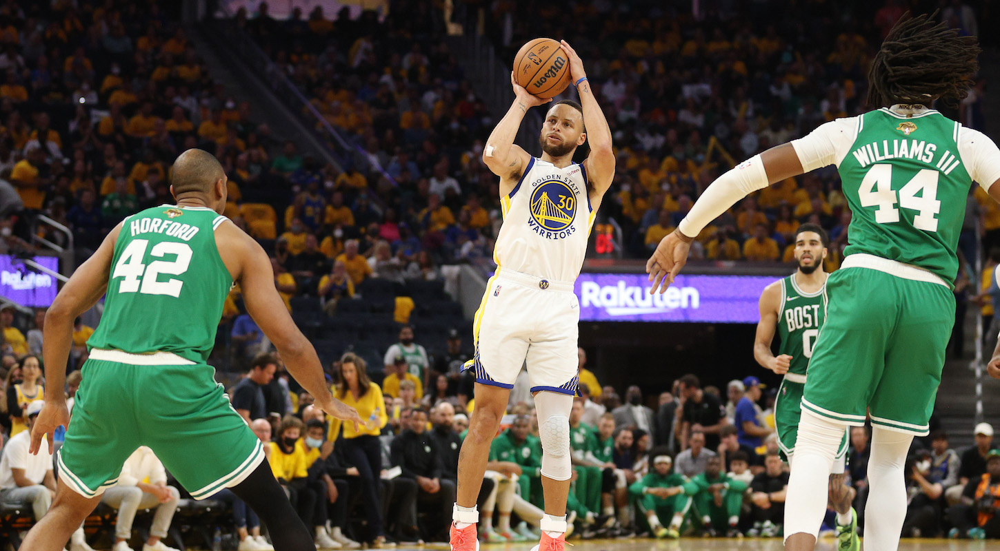 Stephen Curry shoots against Al Horford and Robert Williams in Game 2 of the NBA Finals