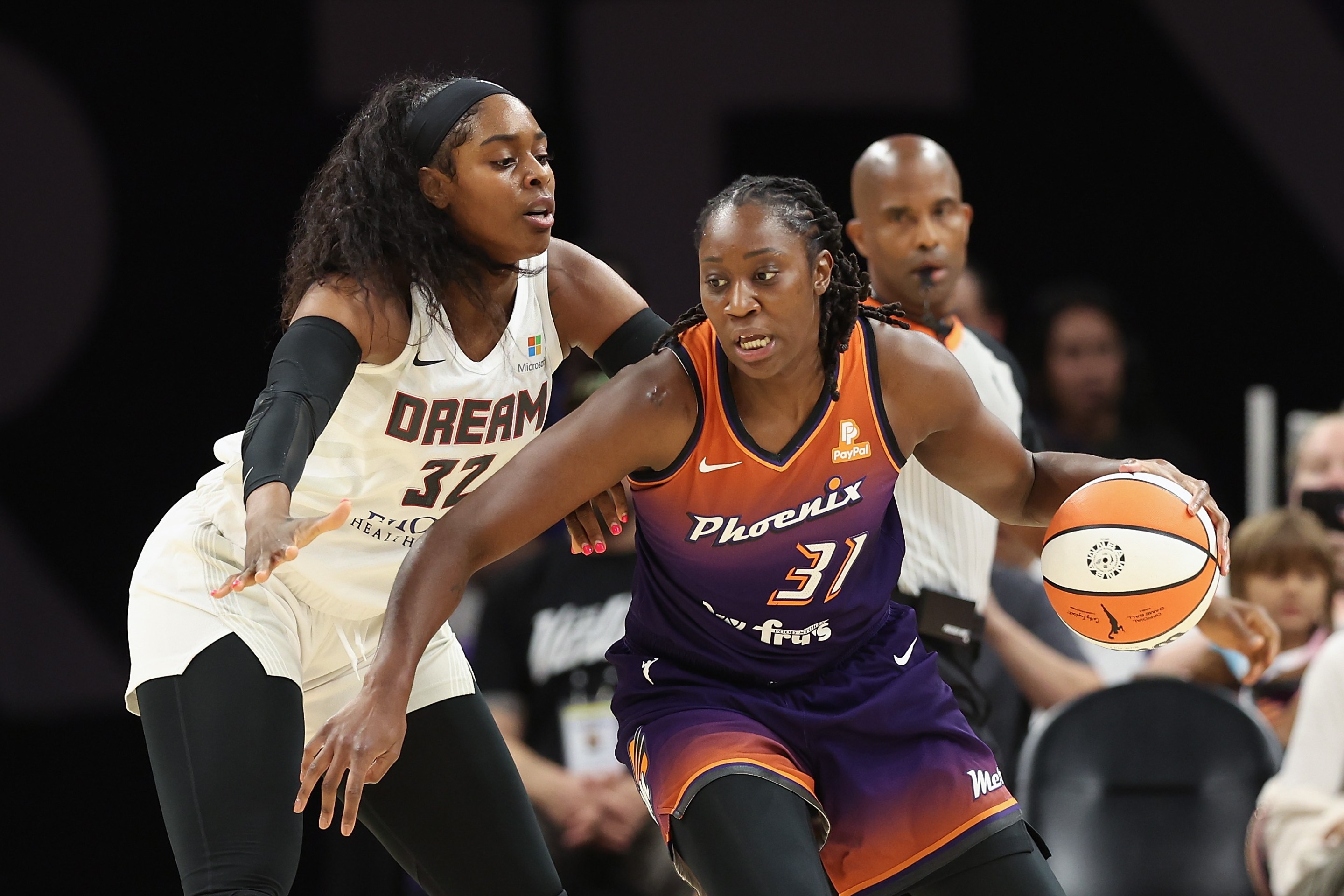 Tina Charles #31 of the Phoenix Mercury handles the ball against Cheyenne Parker #32 of the Atlanta Dream during the first half of the WNBA game at Footprint Center on June 10, 2022 in Phoenix, Arizona.