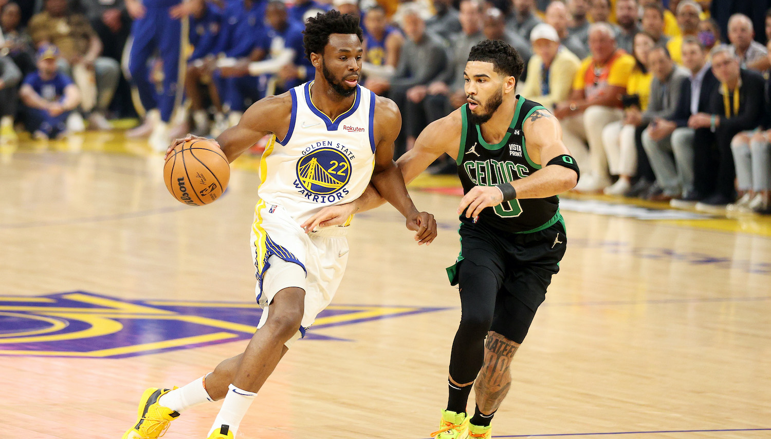 SAN FRANCISCO, CALIFORNIA - JUNE 13: Andrew Wiggins #22 of the Golden State Warriors brings the ball up court against Jayson Tatum #0 of the Boston Celtics during the first quarter in Game Five of the 2022 NBA Finals at Chase Center on June 13, 2022 in San Francisco, California. NOTE TO USER: User expressly acknowledges and agrees that, by downloading and/or using this photograph, User is consenting to the terms and conditions of the Getty Images License Agreement. (Photo by Ezra Shaw/Getty Images)