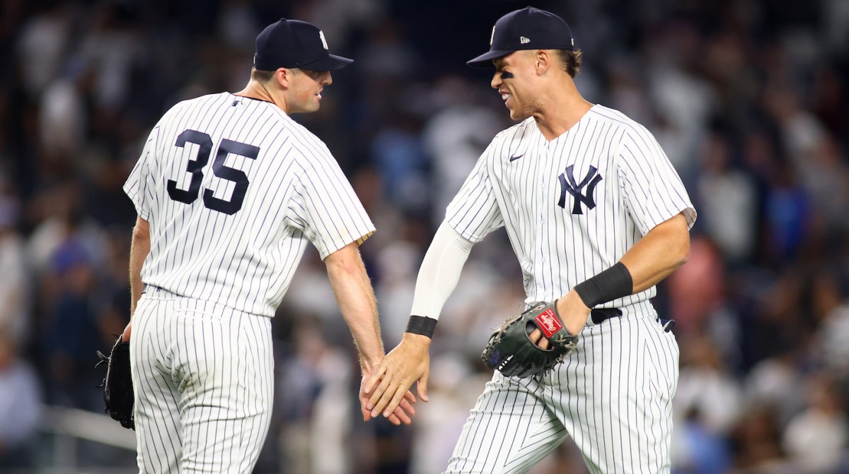 NEW YORK, NEW YORK - JUNE 15: Aaron Judge #99 and Clay Holmes #35 of the New York Yankees celebrates after defeating the Tampa Bay Rays 4-3 at Yankee Stadium on June 15, 2022 in the Bronx borough of New York City. (Photo by Mike Stobe/Getty Images)