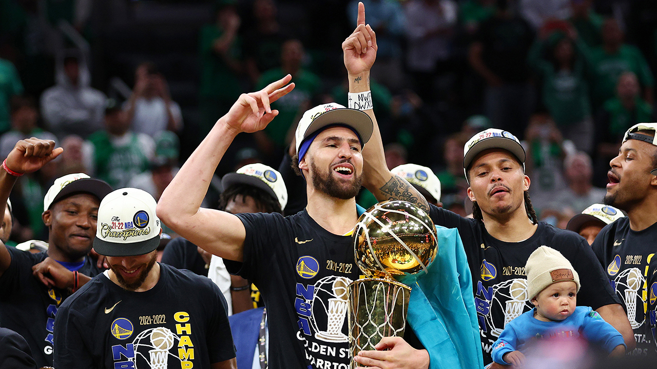 Stephen Curry #30 and Klay Thompson #11 of the Golden State Warriors celebrate after defeating the Boston Celtics 103-90 in Game Six of the 2022 NBA Finals at TD Garden on June 16, 2022 in Boston, Massachusetts.