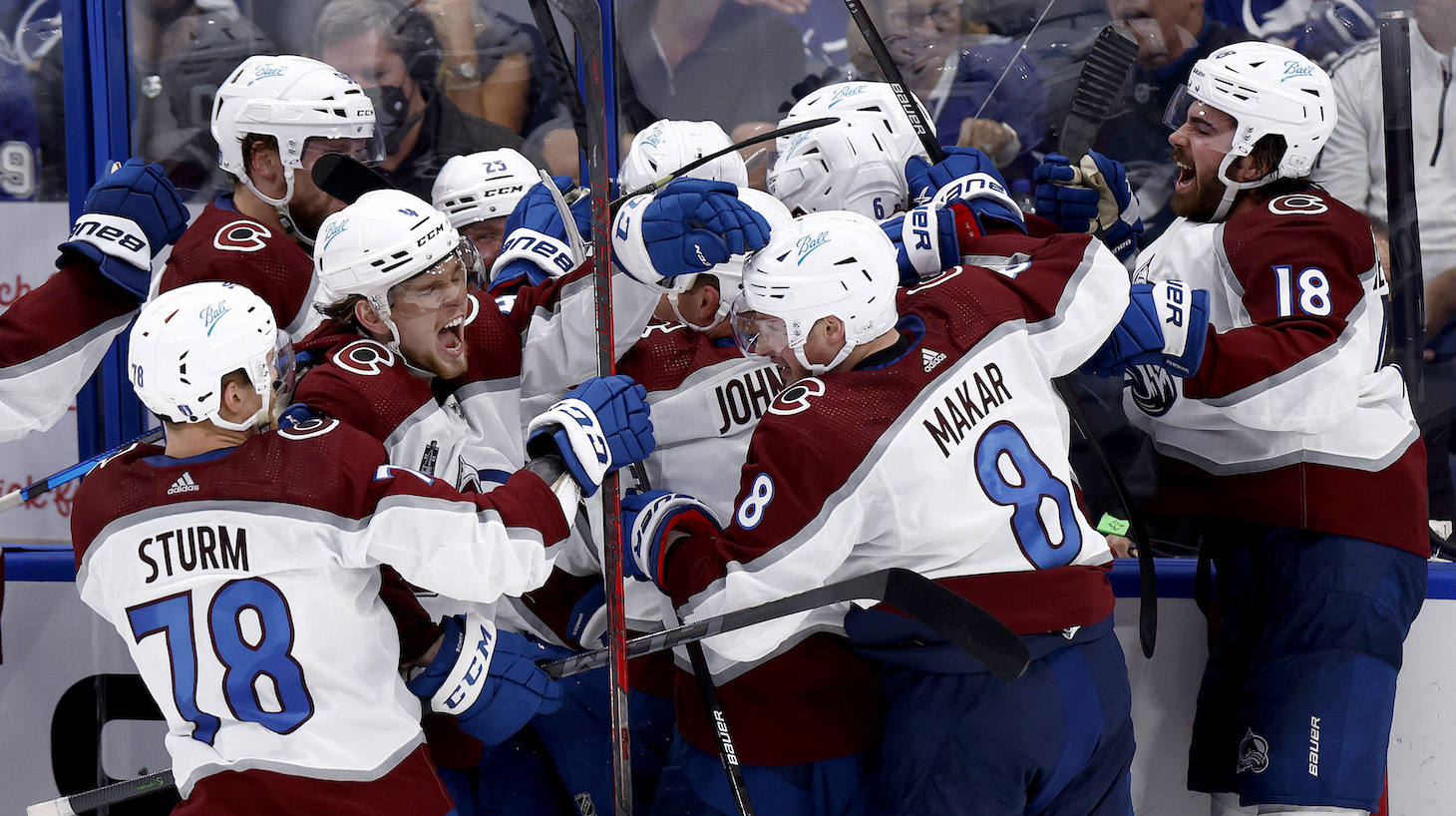 TAMPA, FLORIDA - JUNE 22: Nazem Kadri #91 of the Colorado Avalanche celebrates with teammates after scoring a goal against Andrei Vasilevskiy #88 of the Tampa Bay Lightning to win 3-2 overtime in Game Four of the 2022 NHL Stanley Cup Final at Amalie Arena on June 22, 2022 in Tampa, Florida. (Photo by Douglas P. DeFelice/Getty Images)