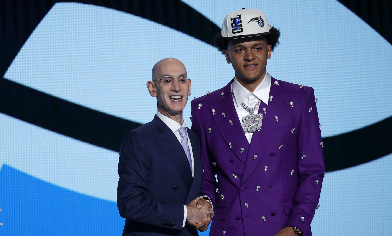 NEW YORK, NEW YORK - JUNE 23: NBA commissioner Adam Silver and Paolo Banchero pose for photos after Banchero was drafted with the 1st overall pick by the Orlando Magic during the 2022 NBA Draft at Barclays Center on June 23, 2022 in New York City. NOTE TO USER: User expressly acknowledges and agrees that, by downloading and or using this photograph, User is consenting to the terms and conditions of the Getty Images License Agreement. (Photo by Sarah Stier/Getty Images)