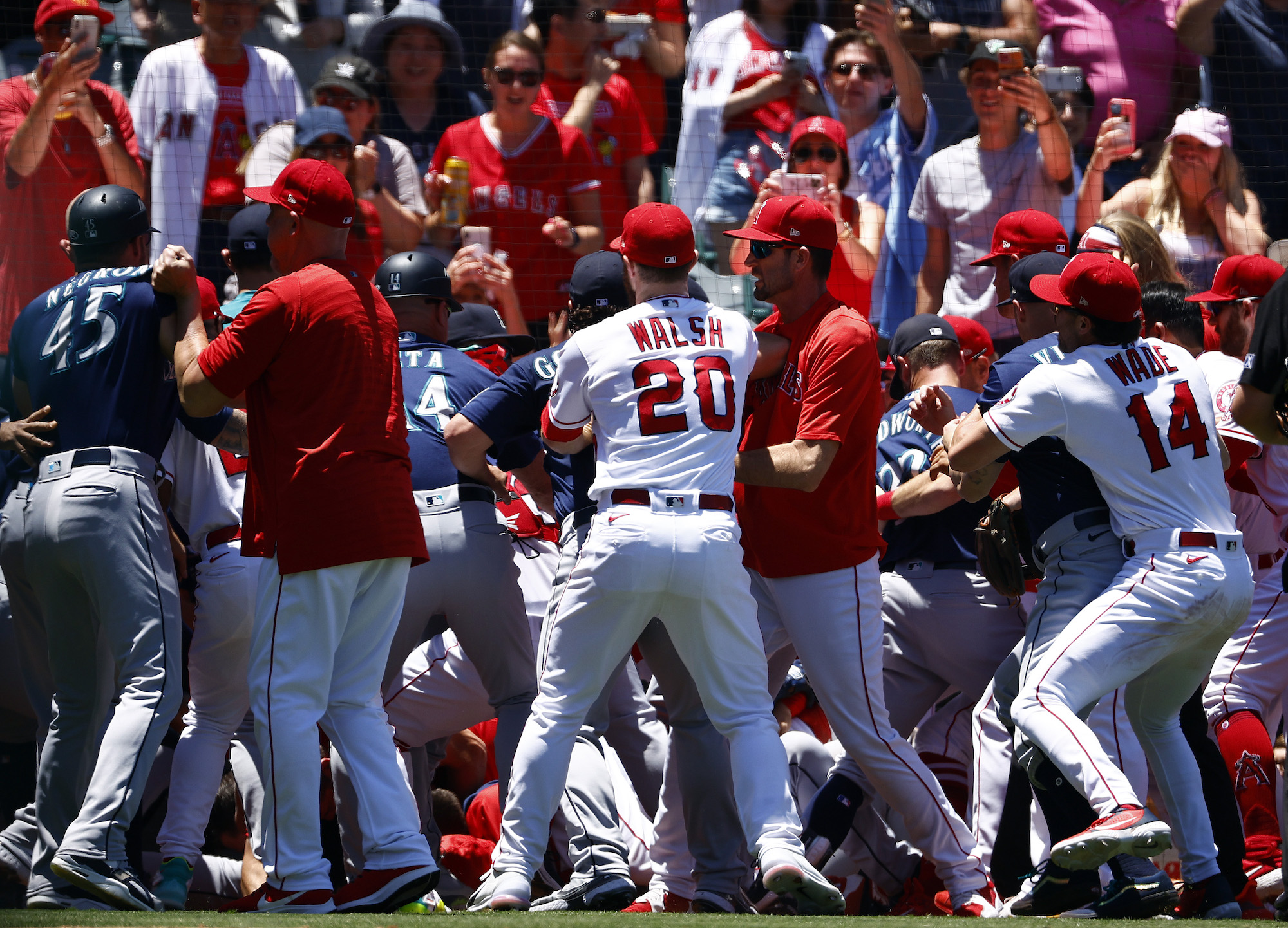 ANAHEIM, CALIFORNIA - JUNE 26: The Seattle Mariners and the Los Angeles Angels clear the benches after Jesse Winker #27 of the Seattle Mariners charged the Angels dugout after being hit by a pitch in the second inning at Angel Stadium of Anaheim on June 26, 2022 in Anaheim, California. (Photo by Ronald Martinez/Getty Images)