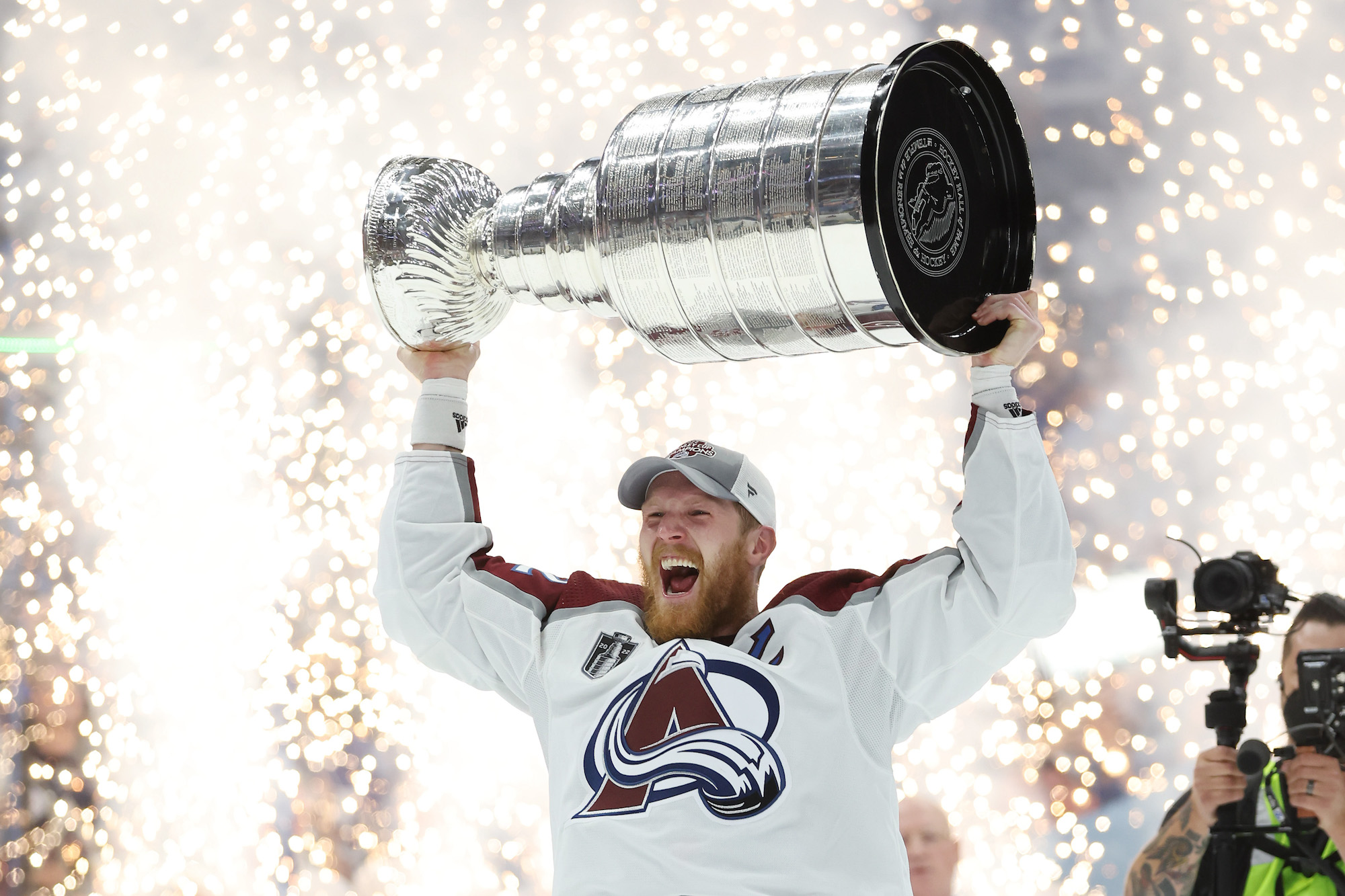 TAMPA, FLORIDA - JUNE 26: Gabriel Landeskog #92 of the Colorado Avalanche lifts the Stanley Cup after defeating the Tampa Bay Lightning 2-1 in Game Six of the 2022 NHL Stanley Cup Final at Amalie Arena on June 26, 2022 in Tampa, Florida. (Photo by Christian Petersen/Getty Images)