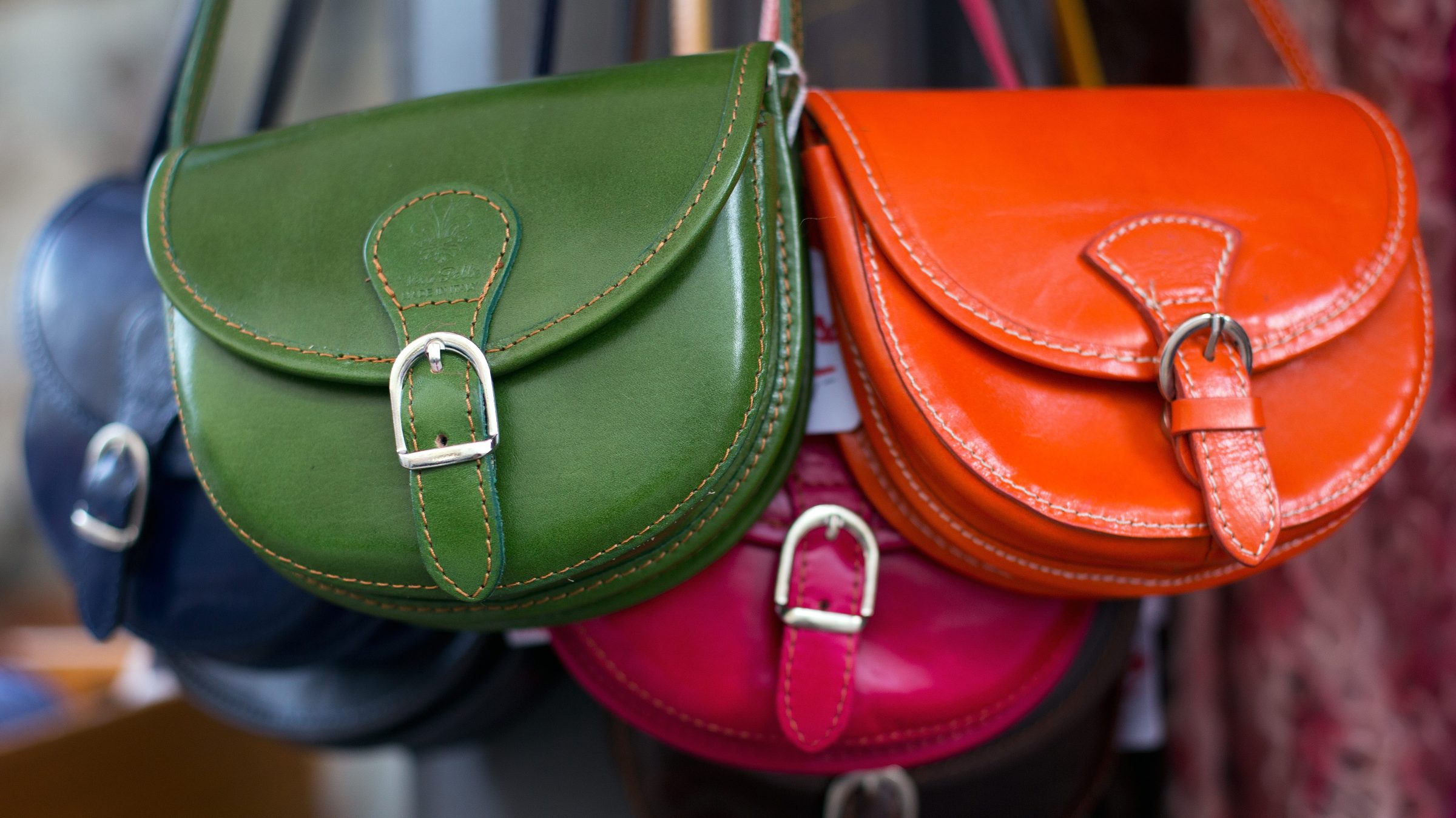 Italian-made coloured leather handbags are for sale at a shop in Berlin on December 12, 2013.