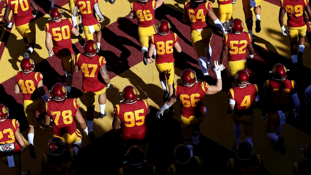 LOS ANGELES, CALIFORNIA - NOVEMBER 23: The USC Trojans run onto the field prior to a game against the UCLA Bruins at Los Angeles Memorial Coliseum on November 23, 2019 in Los Angeles, California. (Photo by Sean M. Haffey/Getty Images)