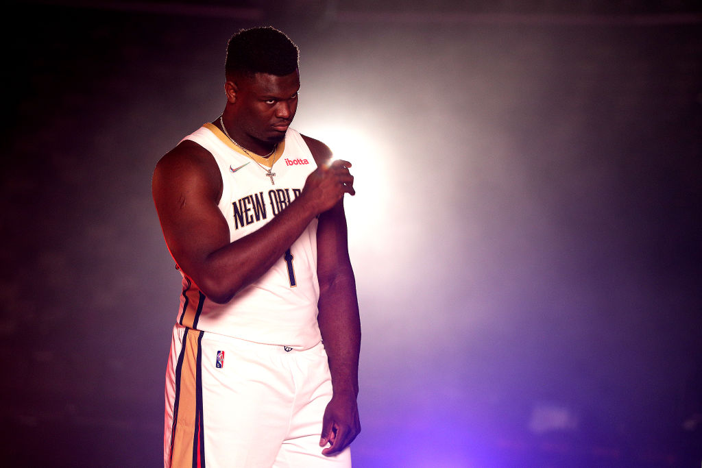 Zion Williamson poses at Pelicans media day.