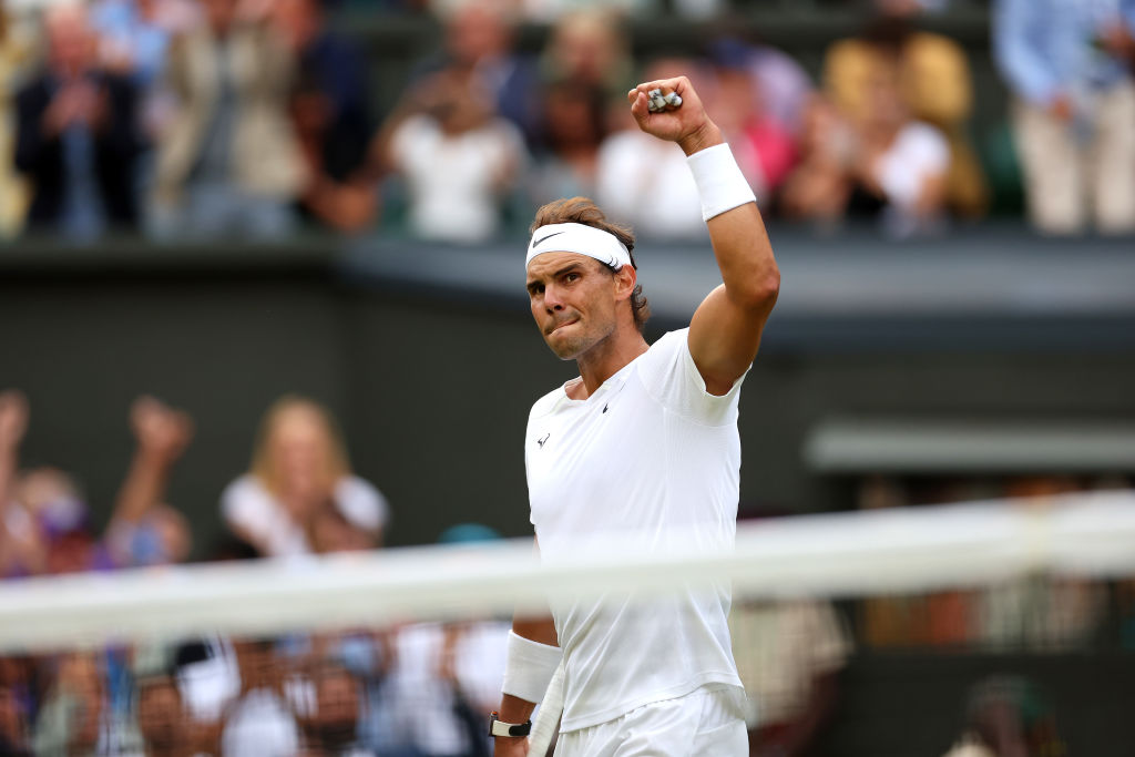 Rafael Nadal pumps a fist during his Wimbledon quarterfinal.