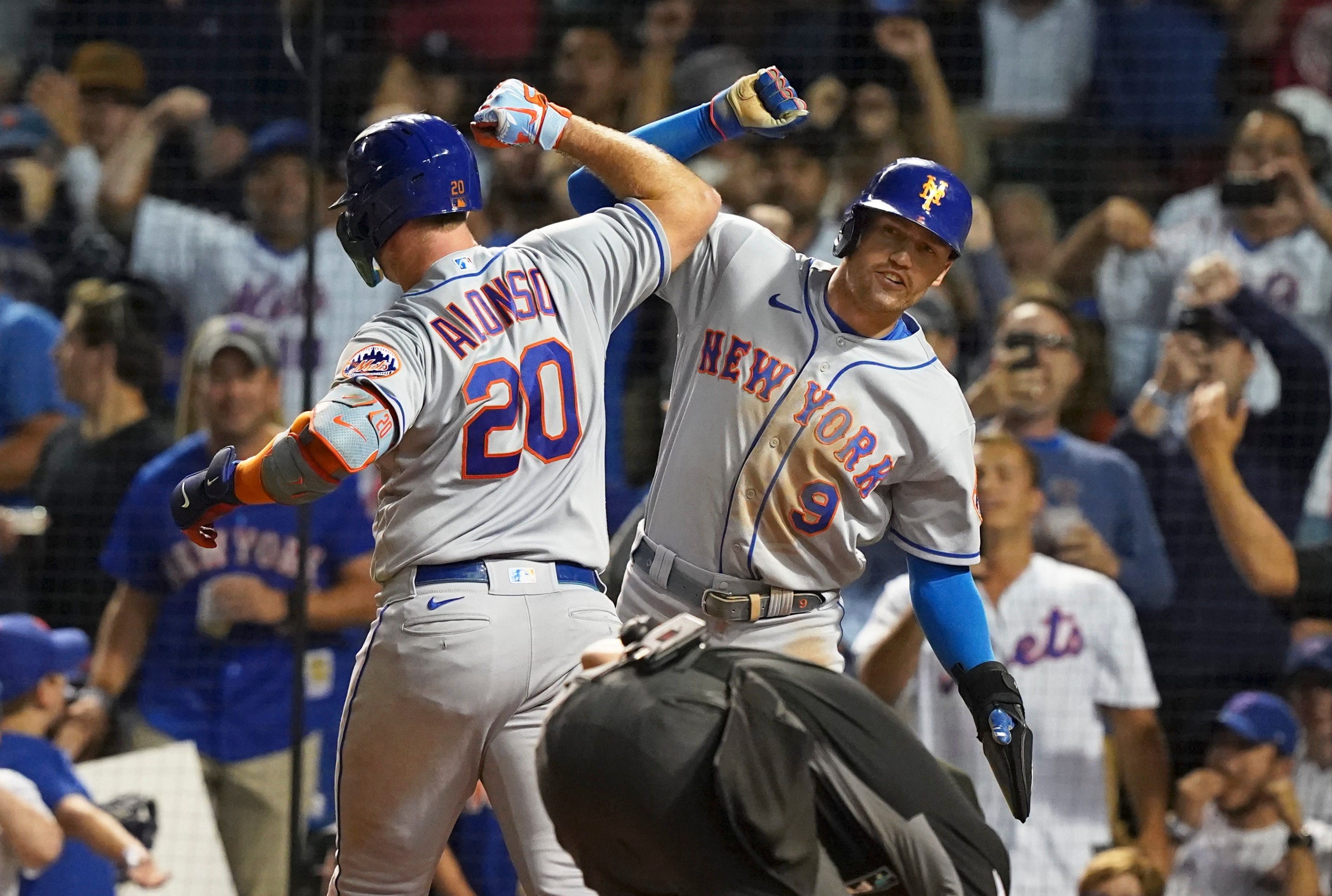 Pete Alonso and Brandon Nimmo do the Bash Brothers forearm thing during a July Mets win against the Cubs.