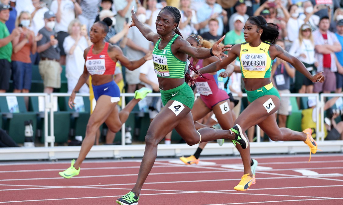 EUGENE, OREGON - JULY 24: Tobi Amusan of Team Nigeria crosses the finish line in the Women's 100m Hurdles Final on day ten of the World Athletics Championships Oregon22 at Hayward Field on July 24, 2022 in Eugene, Oregon. (Photo by Patrick Smith/Getty Images)