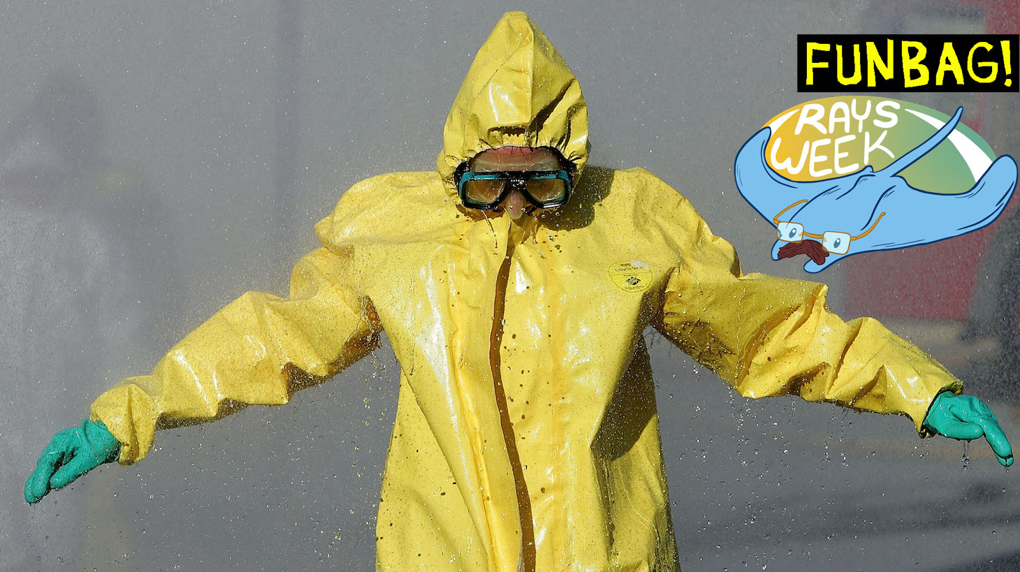 COLMA, CA - FEBRUARY 1: A man wearing a hazardous materials suit walks through a decontamination shower during a weapons of mass destruction training workshop February 1, 2005 in Colma, California. Representatives from several San Mateo County police and fire departments took part in the one day training to prepare for a chemical or biological attack. (Photo by Justin Sullivan/Getty Images)