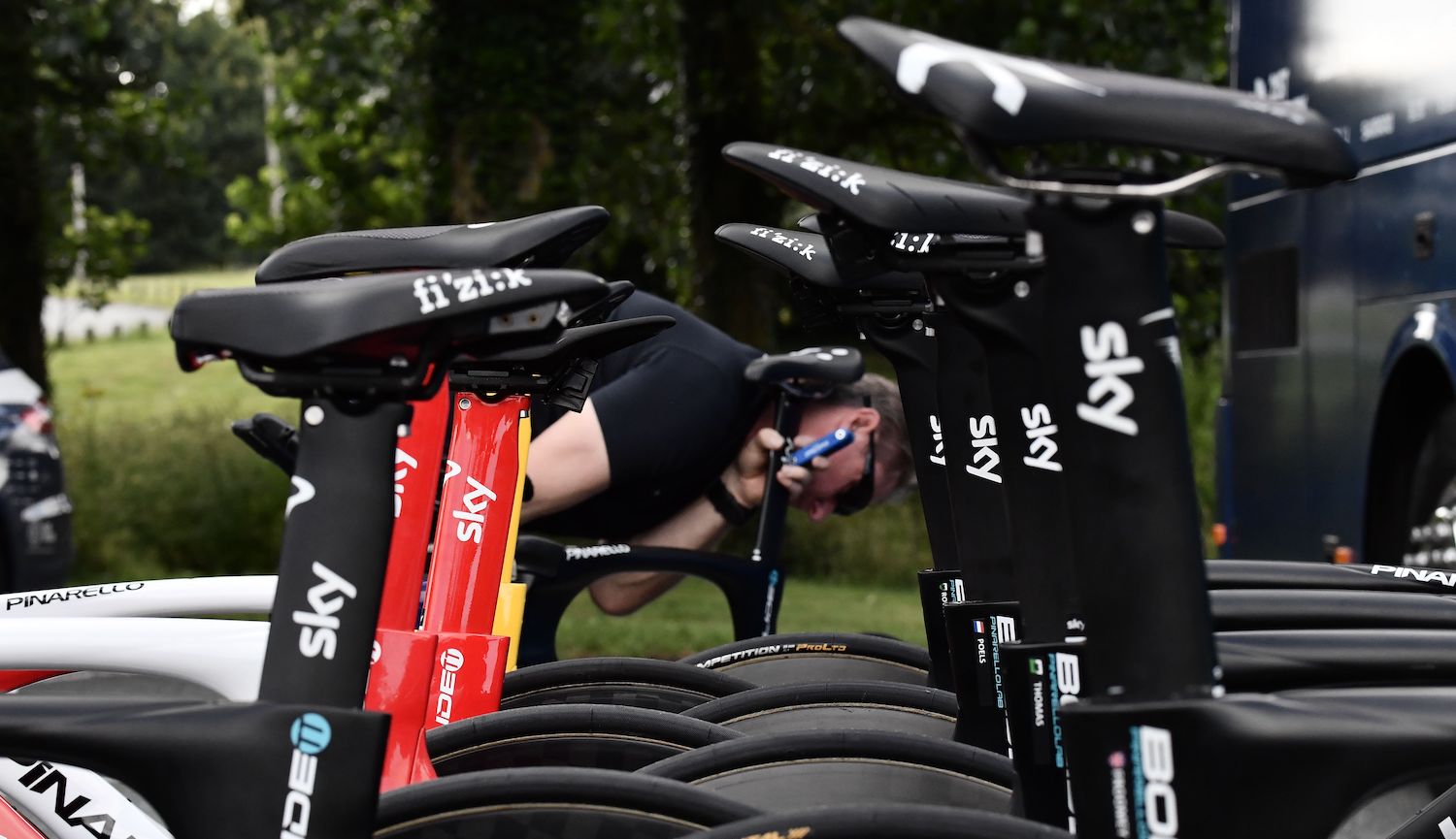 A mechanic prepares the bicycles of Team Sky cycling team prior to a training session on July 4, 2018 in Saint-Mars-la-Reorthe, western France, three days prior to the start of the 105th edition of the Tour de France cycling race. (Photo by Jeff PACHOUD / AFP) (Photo credit should read JEFF PACHOUD/AFP via Getty Images)