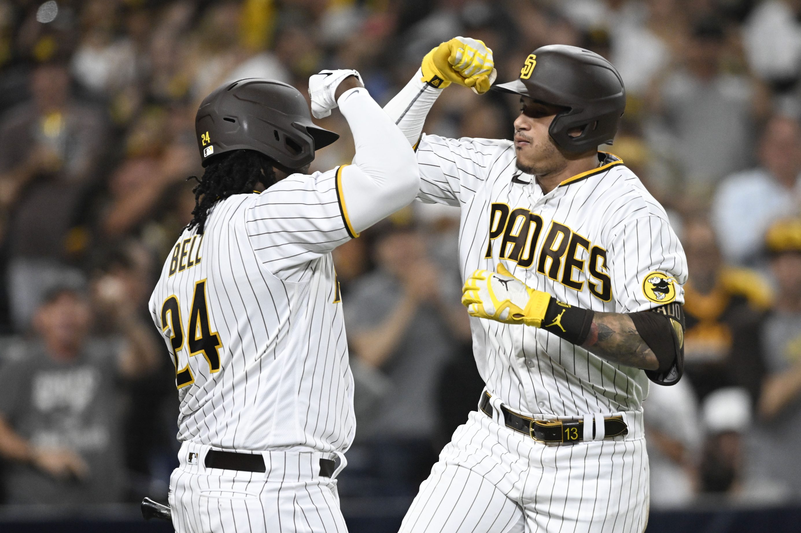 Manny Machado celebrates a home run with Josh Bell