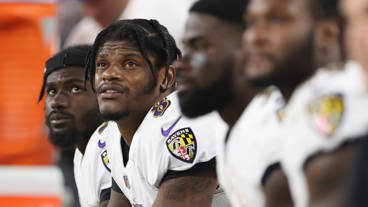 LAS VEGAS, NEVADA - SEPTEMBER 13: Quarterback Lamar Jackson #8 of the Baltimore Ravens watches from the bench during the NFL game against the Las Vegas Raiders at Allegiant Stadium on September 13, 2021 in Las Vegas, Nevada. The Raiders defeated the Ravens 33-27 in overtime. (Photo by Christian Petersen/Getty Images)