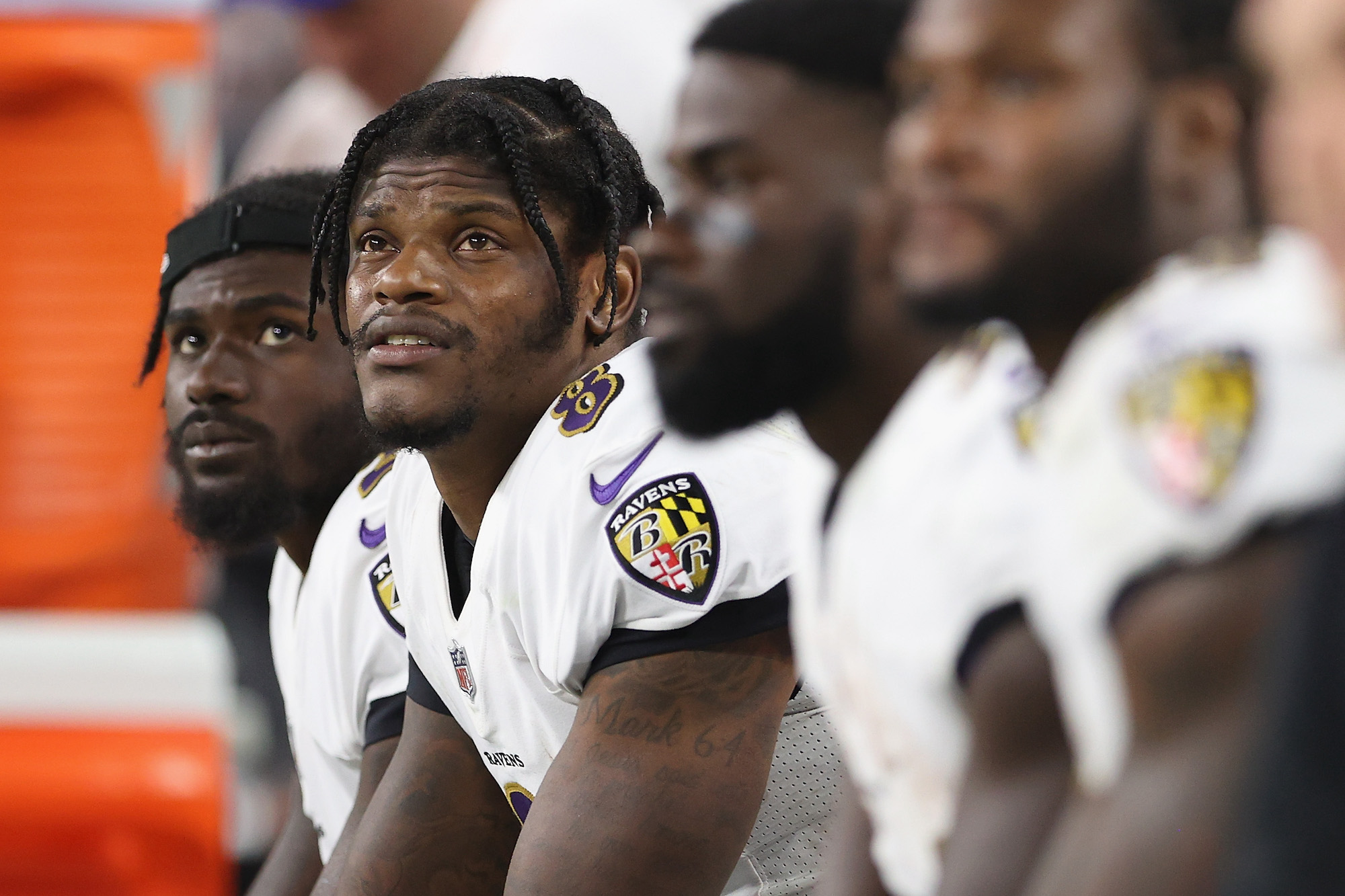 LAS VEGAS, NEVADA - SEPTEMBER 13: Quarterback Lamar Jackson #8 of the Baltimore Ravens watches from the bench during the NFL game against the Las Vegas Raiders at Allegiant Stadium on September 13, 2021 in Las Vegas, Nevada. The Raiders defeated the Ravens 33-27 in overtime. (Photo by Christian Petersen/Getty Images)