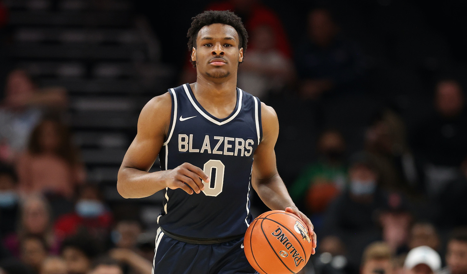 PHOENIX, ARIZONA - DECEMBER 11: Bronny James #0 of the Sierra Canyon Trailblazers handles the ball during the Hoophall West tournament against the Perry Pumas at Footprint Center on December 11, 2021 in Phoenix, Arizona. (Photo by Christian Petersen/Getty Images)