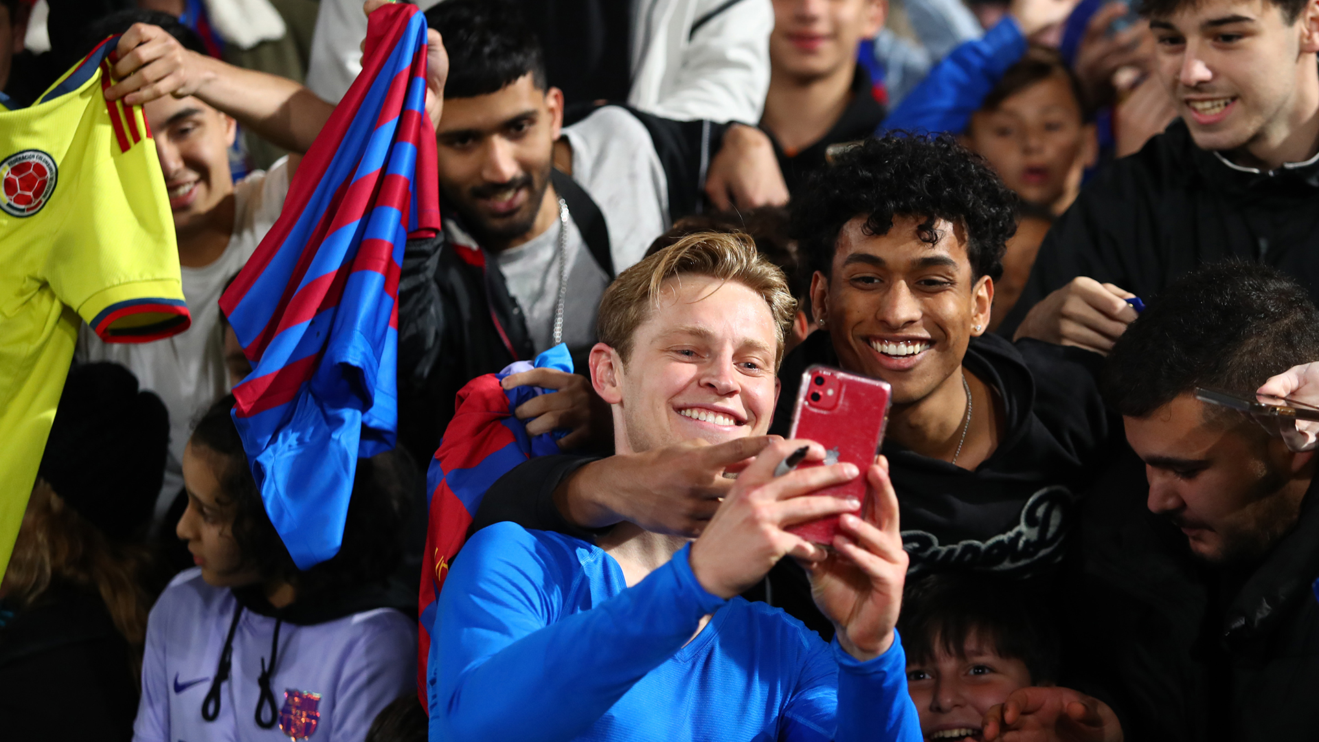 Frenkie de Jong of FC Barcelona takes a selfie with fans during the match between FC Barcelona and the A-League All Stars at Accor Stadium on May 25, 2022 in Sydney, Australia.