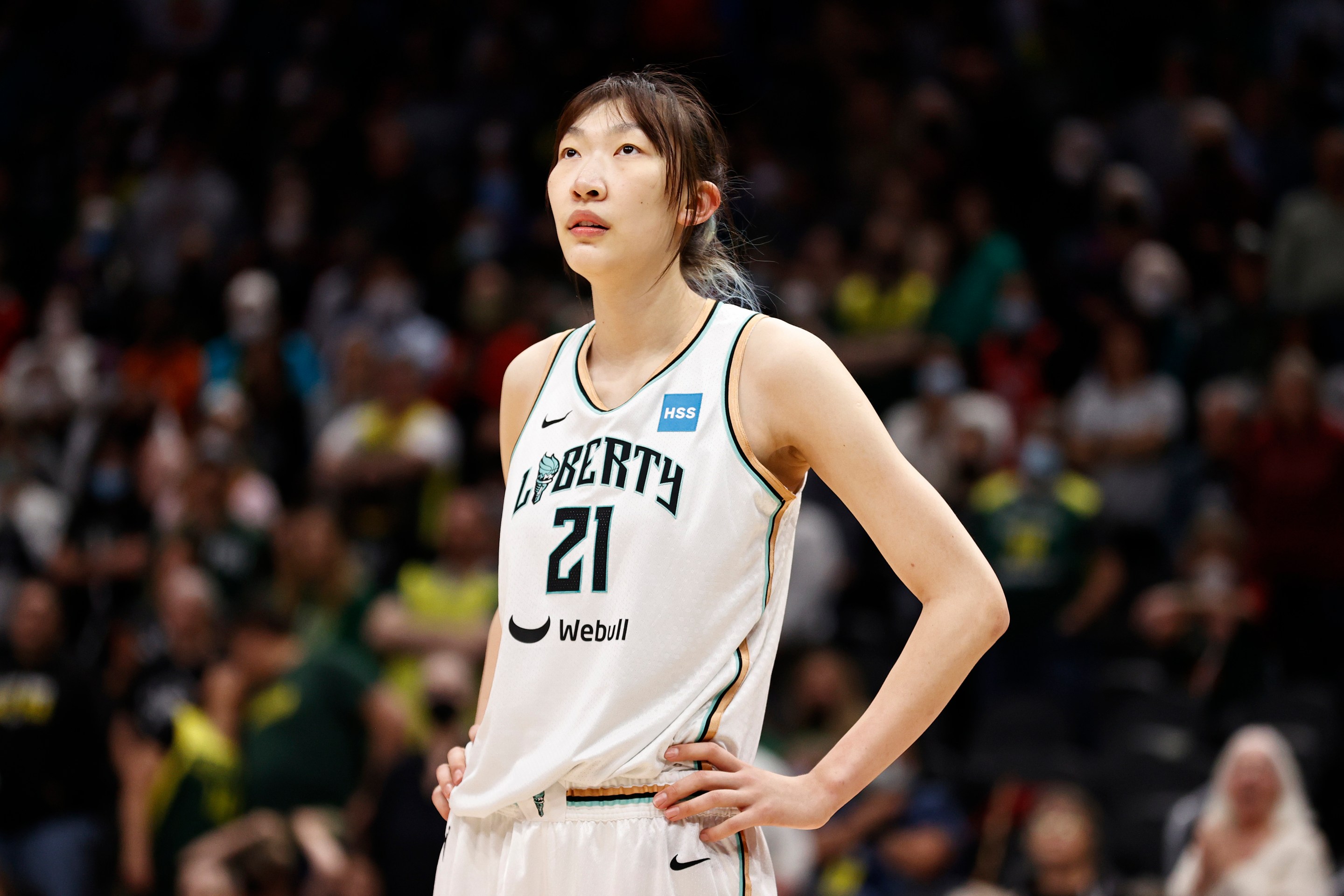 SEATTLE, WASHINGTON - MAY 27: Han Xu #21 of the New York Liberty looks on against the Seattle Storm in overtime at Climate Pledge Arena on May 27, 2022 in Seattle, Washington.