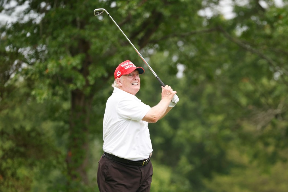 Former President Donald Trump's follow-through on a drive during a LIV Golf pro-am event at his golf club in Bedminster, NJ. He looks boiled.