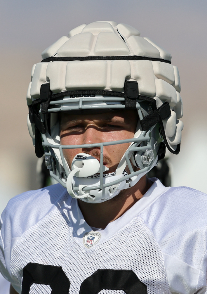 Some Raiders guy with a giant mushroom helmet