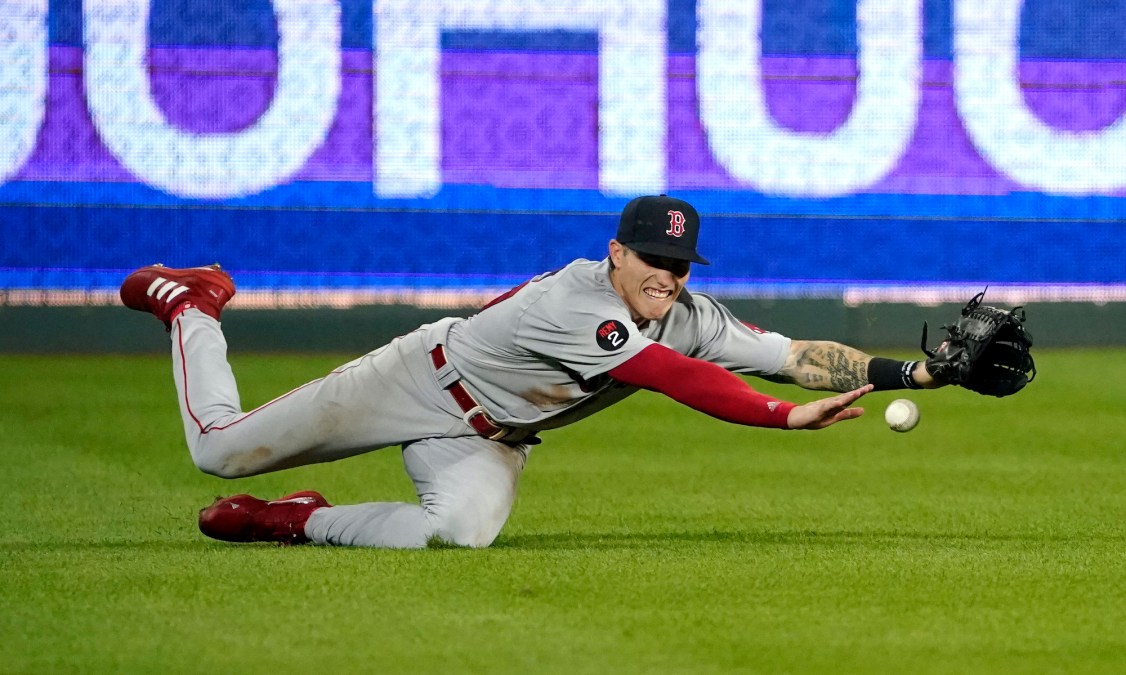 Boston Red Sox outfielder Jarren Duran fails to catch a ball.