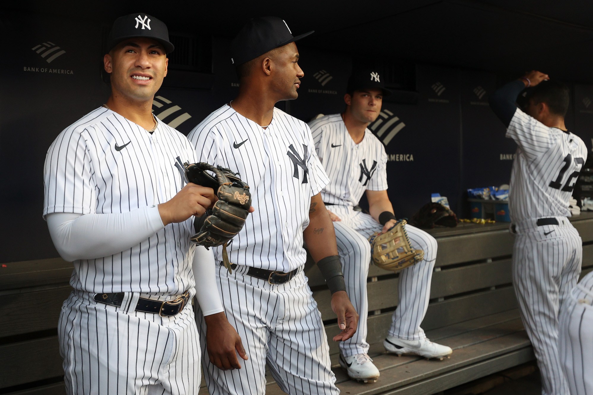 NEW YORK, NEW YORK - AUGUST 16: Gleyber Torres #25 and Miguel Andujar #41 of the New York Yankees look on from the dugout during the first inning against the Tampa Bay Rays at Yankee Stadium on August 16, 2022 in the Bronx borough of New York City. (Photo by Sarah Stier/Getty Images)