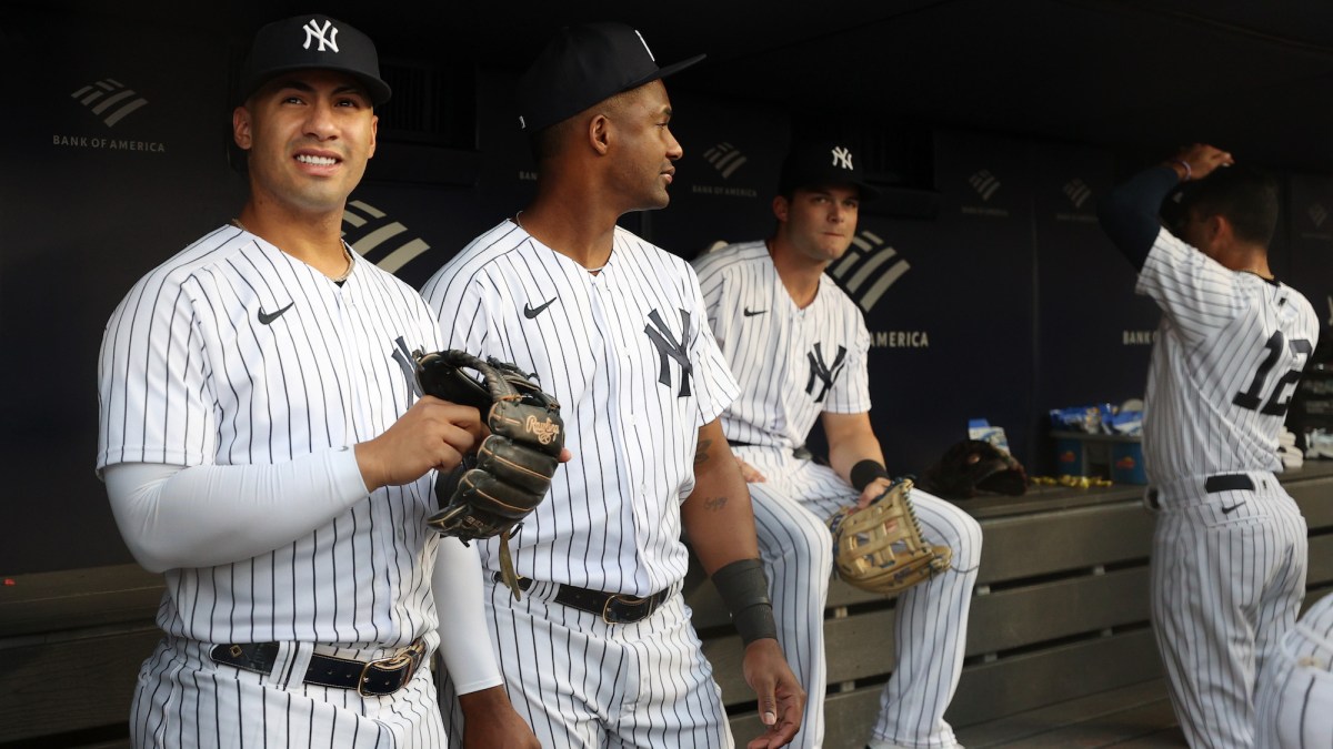 NEW YORK, NEW YORK - AUGUST 16: Gleyber Torres #25 and Miguel Andujar #41 of the New York Yankees look on from the dugout during the first inning against the Tampa Bay Rays at Yankee Stadium on August 16, 2022 in the Bronx borough of New York City. (Photo by Sarah Stier/Getty Images)