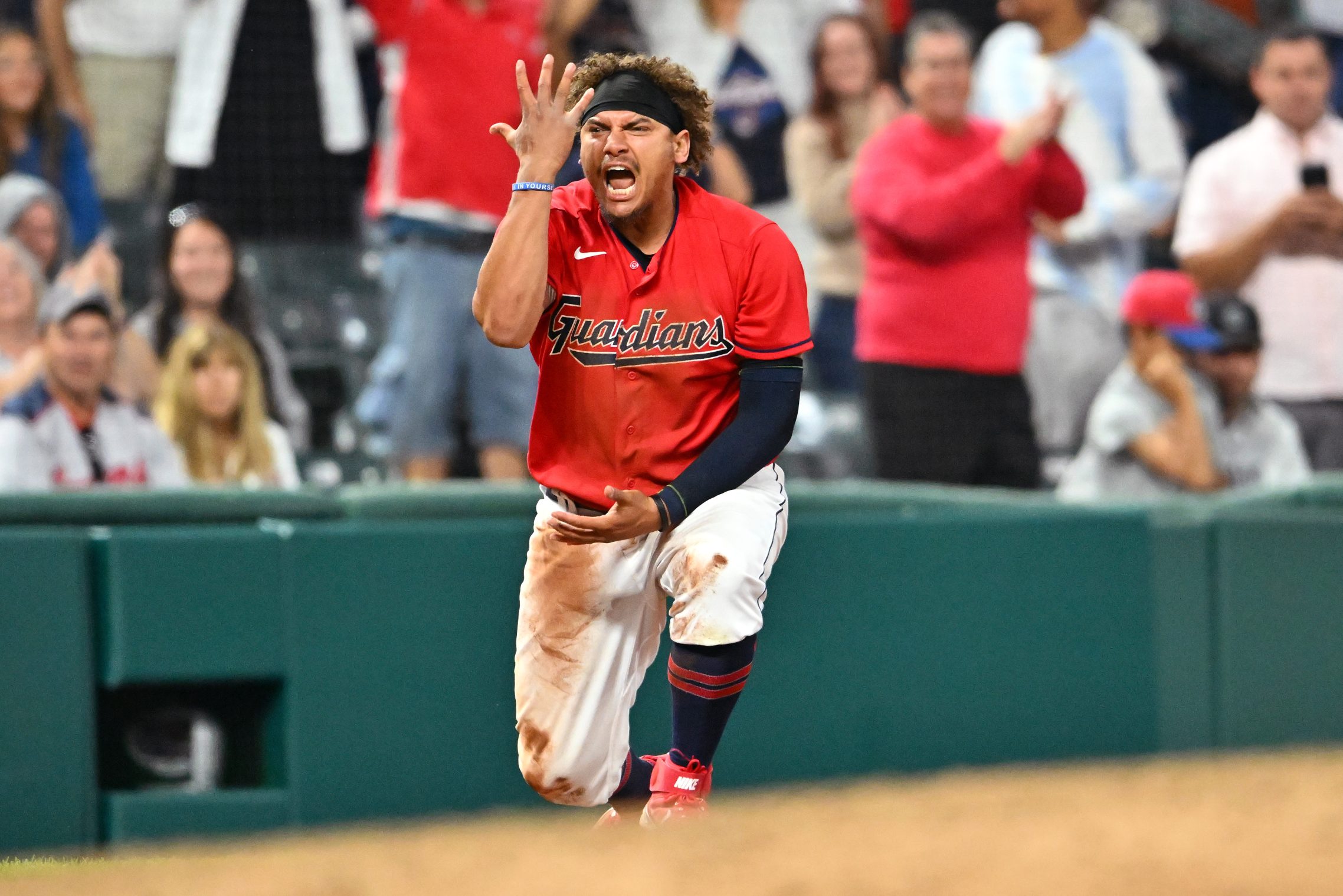 Josh Naylor celebrates at third base