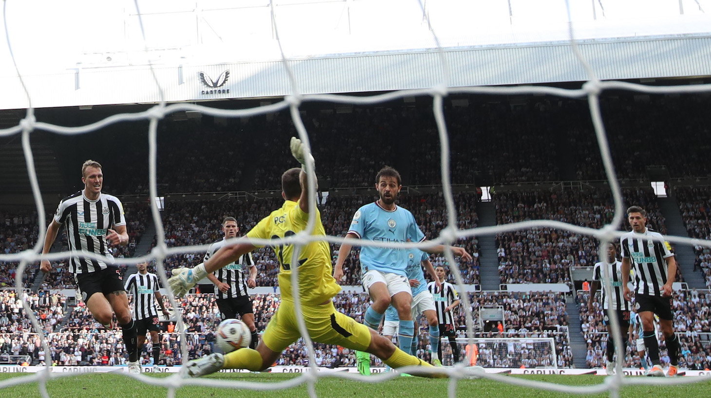 Bernardo Silva of Manchester City scores their side's third goal during the Premier League match between Newcastle United and Manchester City at St. James Park on August 21, 2022 in Newcastle upon Tyne, England.