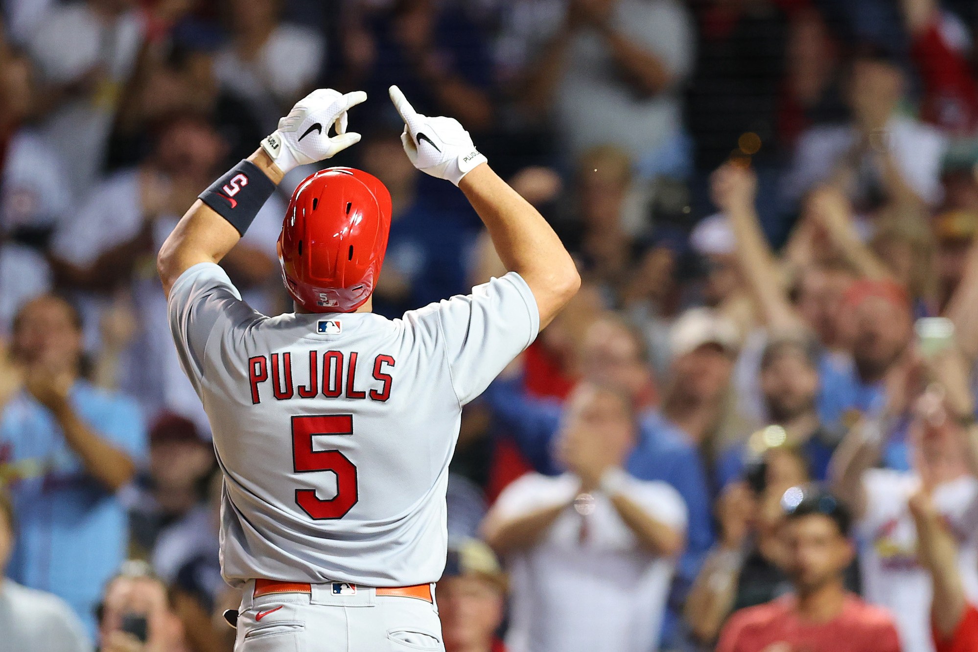 CHICAGO, ILLINOIS - AUGUST 22: Albert Pujols #5 of the St. Louis Cardinals celebrates his solo home run during the seventh inning against the Chicago Cubs at Wrigley Field on August 22, 2022 in Chicago, Illinois. (Photo by Michael Reaves/Getty Images)
