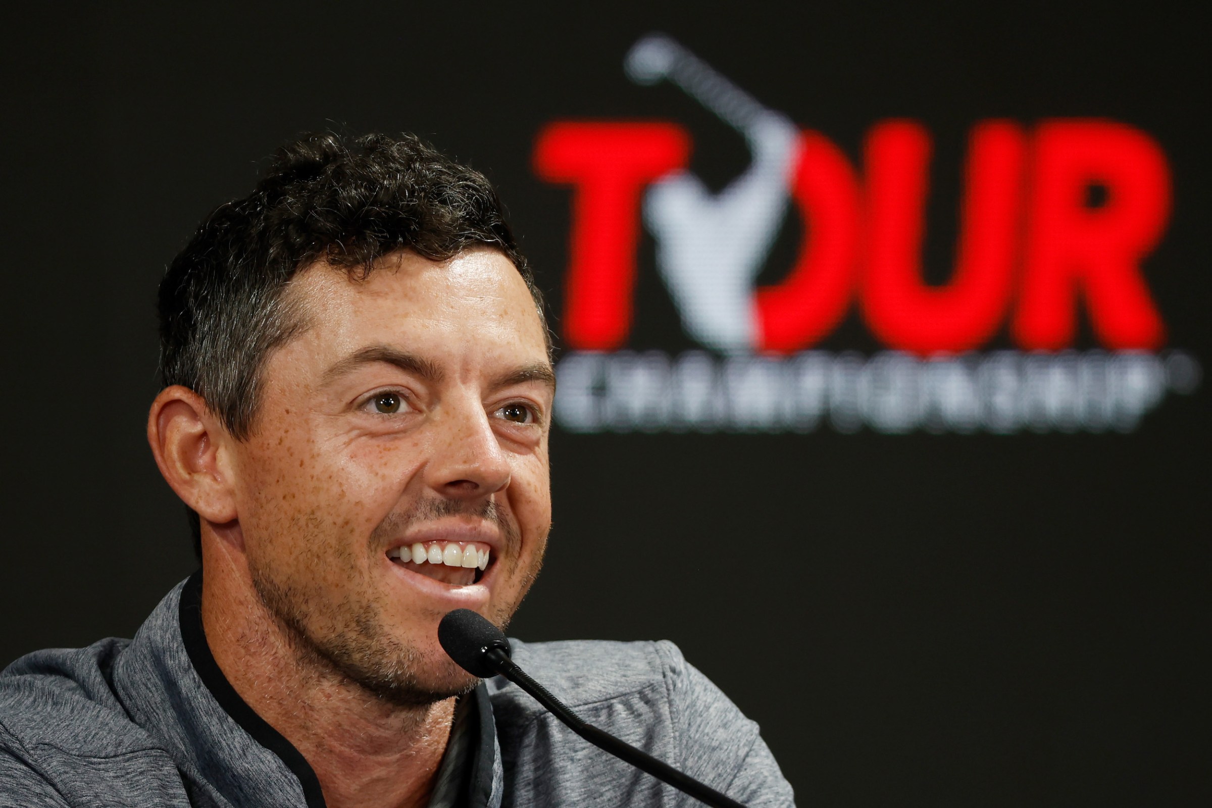 Rory McIlroy smiles at the news conference.