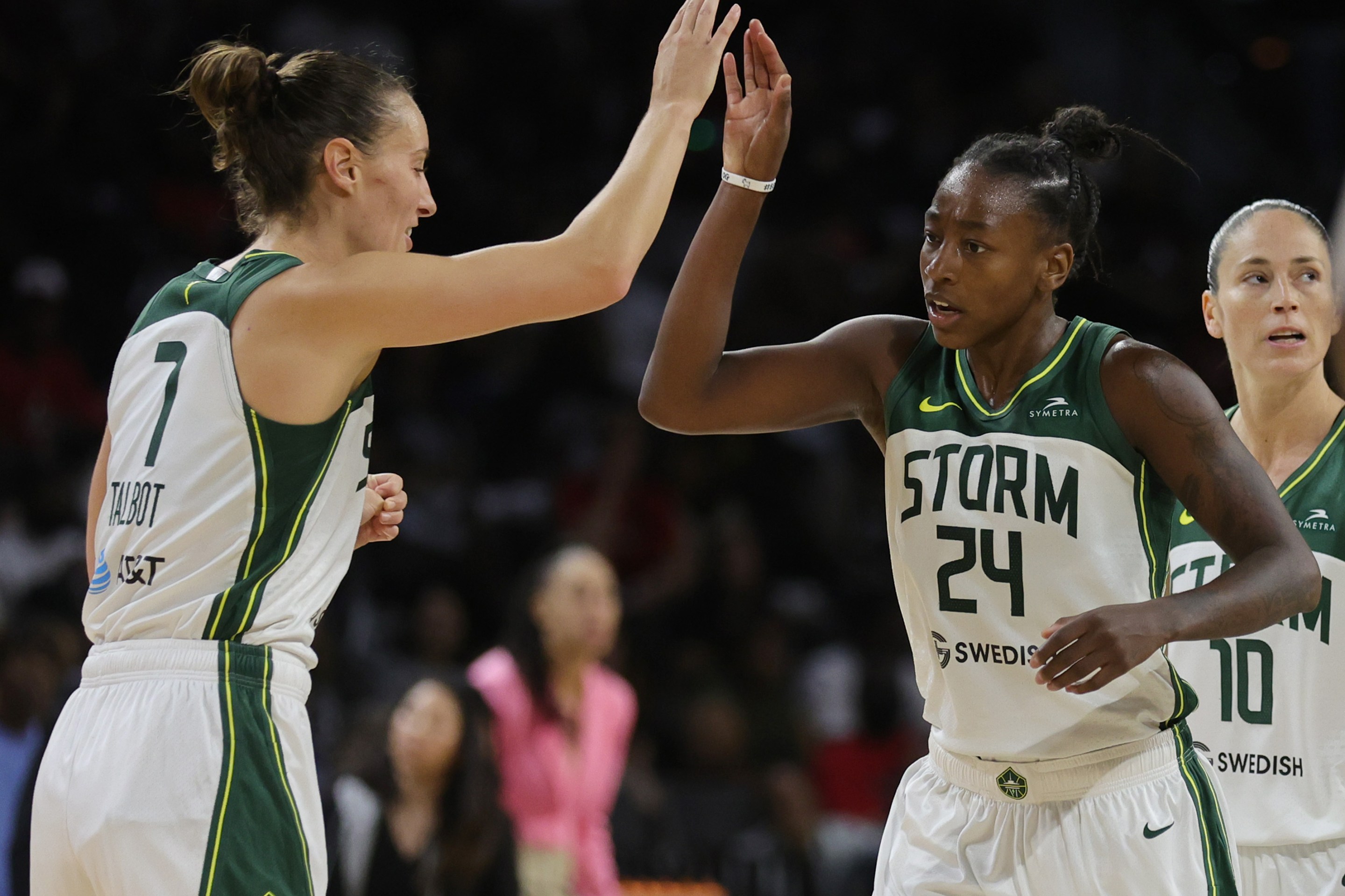 Stephanie Talbot #7 of the Seattle Storm high-fives Jewell Loyd #24 after she hit a 3-pointer against the Las Vegas Aces in the fourth quarter of Game One of the 2022 WNBA Playoffs semifinals at Michelob ULTRA Arena on August 28, 2022 in Las Vegas, Nevada. The Storm defeated the Aces 76-73.