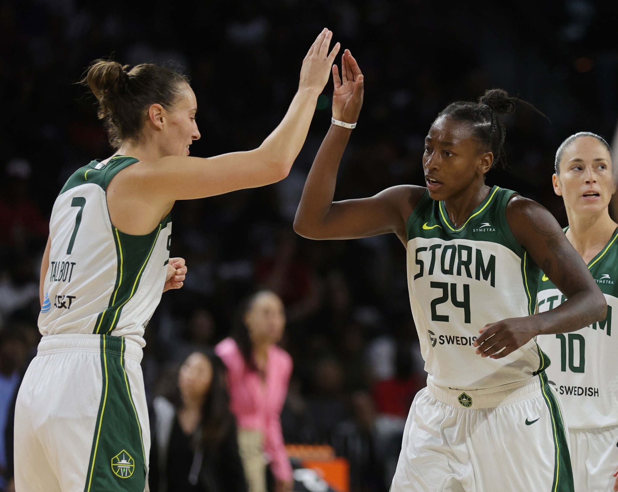 Stephanie Talbot #7 of the Seattle Storm high-fives Jewell Loyd #24 after she hit a 3-pointer against the Las Vegas Aces in the fourth quarter of Game One of the 2022 WNBA Playoffs semifinals at Michelob ULTRA Arena on August 28, 2022 in Las Vegas, Nevada. The Storm defeated the Aces 76-73.