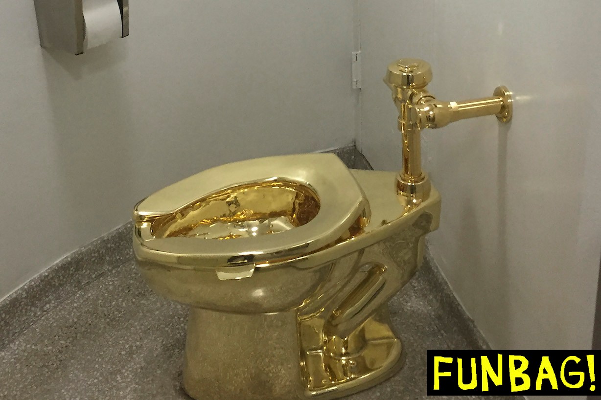 A fully functioning solid gold toilet, made by Italian artist Maurizio Cattelan, is going into public use at the Guggenheim Museum in New York on September 15, 2016. - A guard will be stationed outside the bathroom to protect the work, entitled 'America', which recalls Marcel Duchamp's famous work, 'Fountain'. (Photo by William EDWARDS / AFP) (Photo by WILLIAM EDWARDS/AFP via Getty Images)