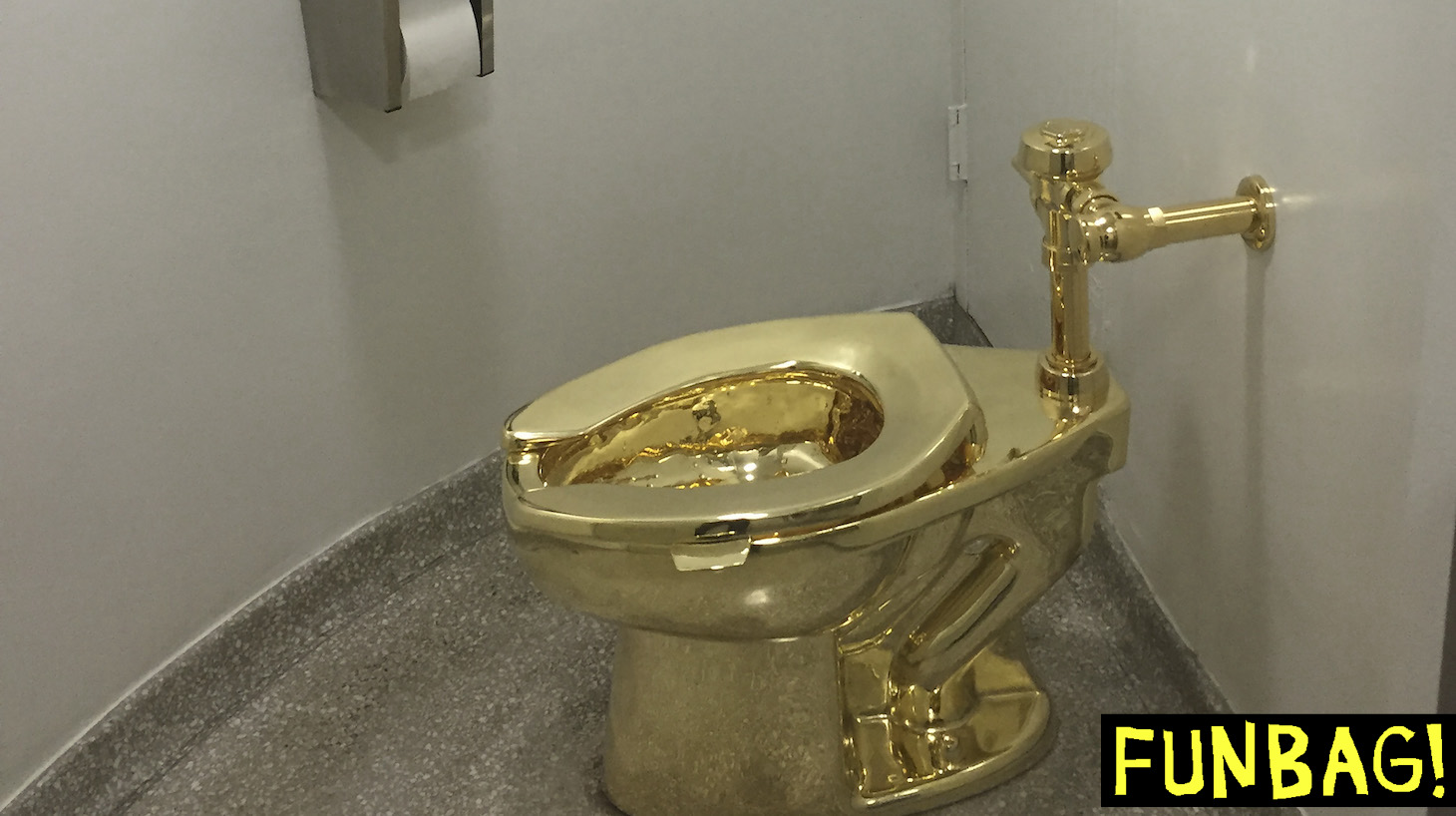 A fully functioning solid gold toilet, made by Italian artist Maurizio Cattelan, is going into public use at the Guggenheim Museum in New York on September 15, 2016. - A guard will be stationed outside the bathroom to protect the work, entitled 'America', which recalls Marcel Duchamp's famous work, 'Fountain'. (Photo by William EDWARDS / AFP) (Photo by WILLIAM EDWARDS/AFP via Getty Images)