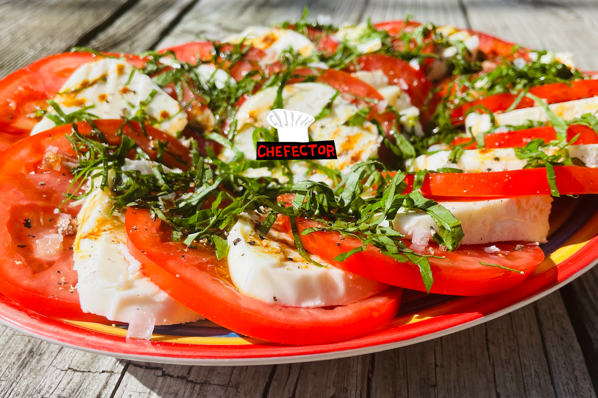 A plate with a Caprese salad all over it