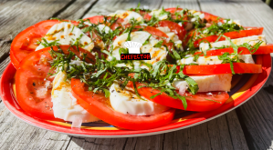 A plate with a Caprese salad all over it