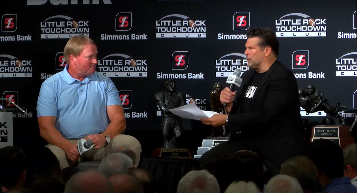 Disgraced coach Jon Gruden speaks at an interview for the Little Rock Touchdown Club