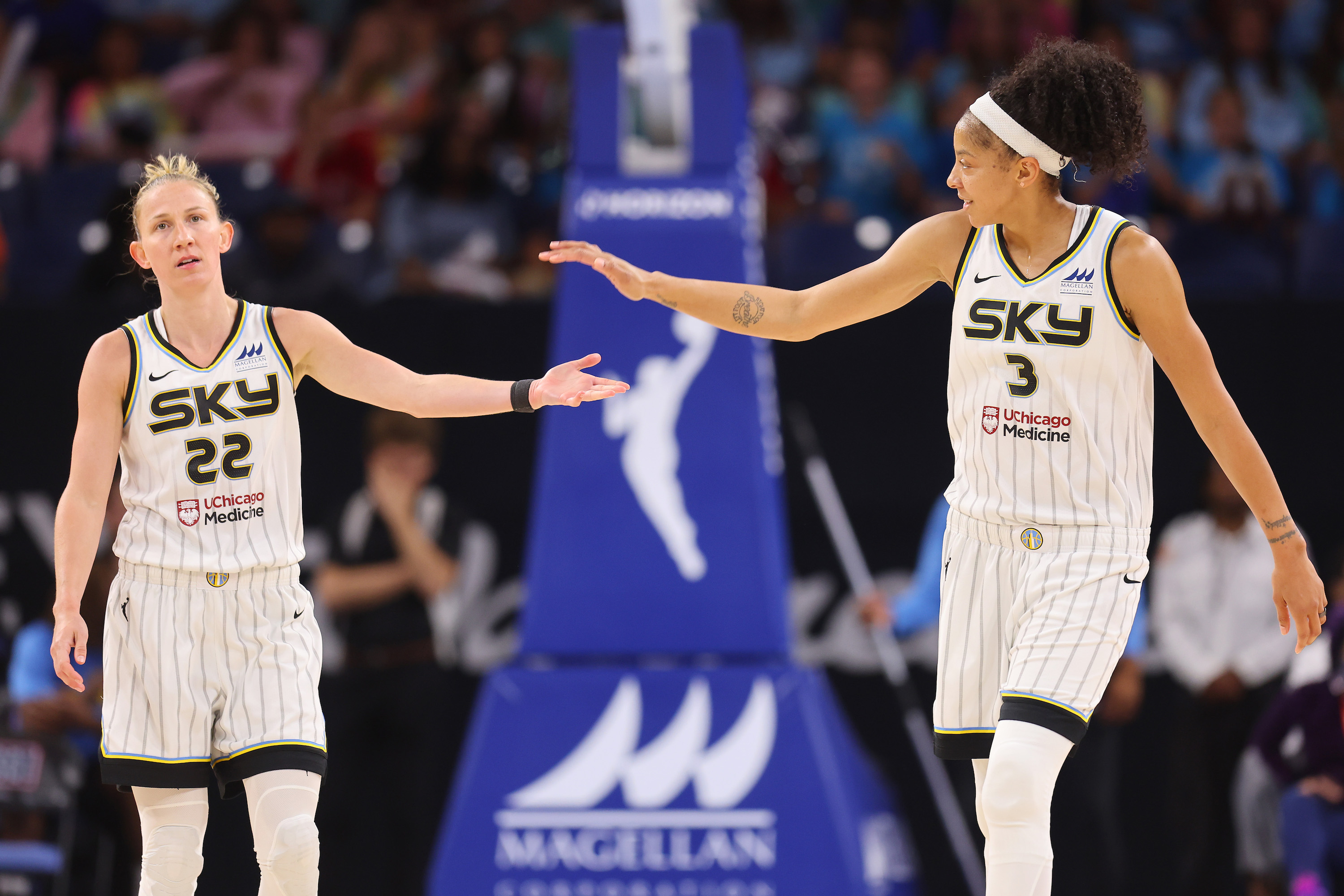 CHICAGO, ILLINOIS - AUGUST 02: Courtney Vandersloot #22 and Candace Parker #3 of the Chicago Sky celebrate against the Dallas Wings during the second half at Wintrust Arena on August 02, 2022 in Chicago, Illinois.