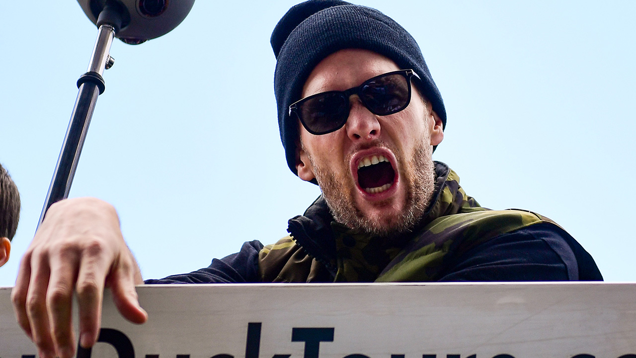 Tom Brady, wearing a beanie, yells during the 2019 Super Bowl parade