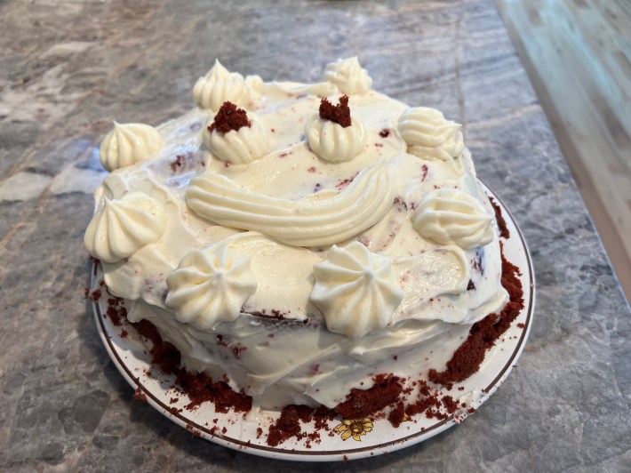 a finished cake with a smiley face