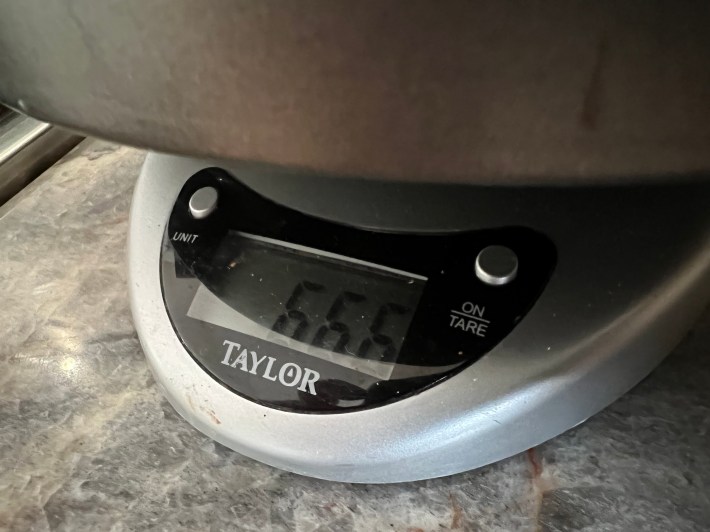 a food scale showing 666 grams of cake batter