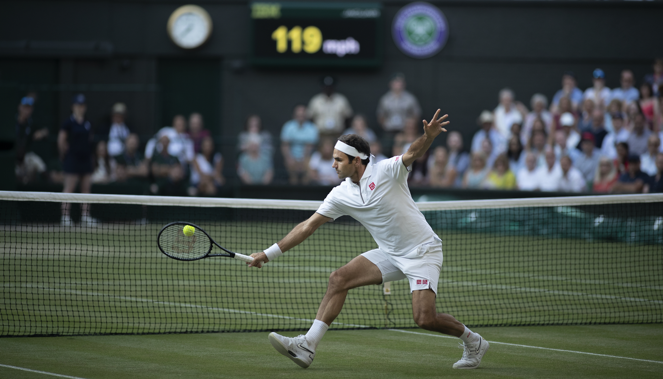 A general view of Roger Federer of Switzerland playing a volley at the net during his match against Rafael Nadal of Spain during the Men's Singles Semifinals on Centre Court during the Wimbledon Lawn Tennis Championships at the All England Lawn Tennis and Croquet Club at Wimbledon on July 12, 2019 in London.