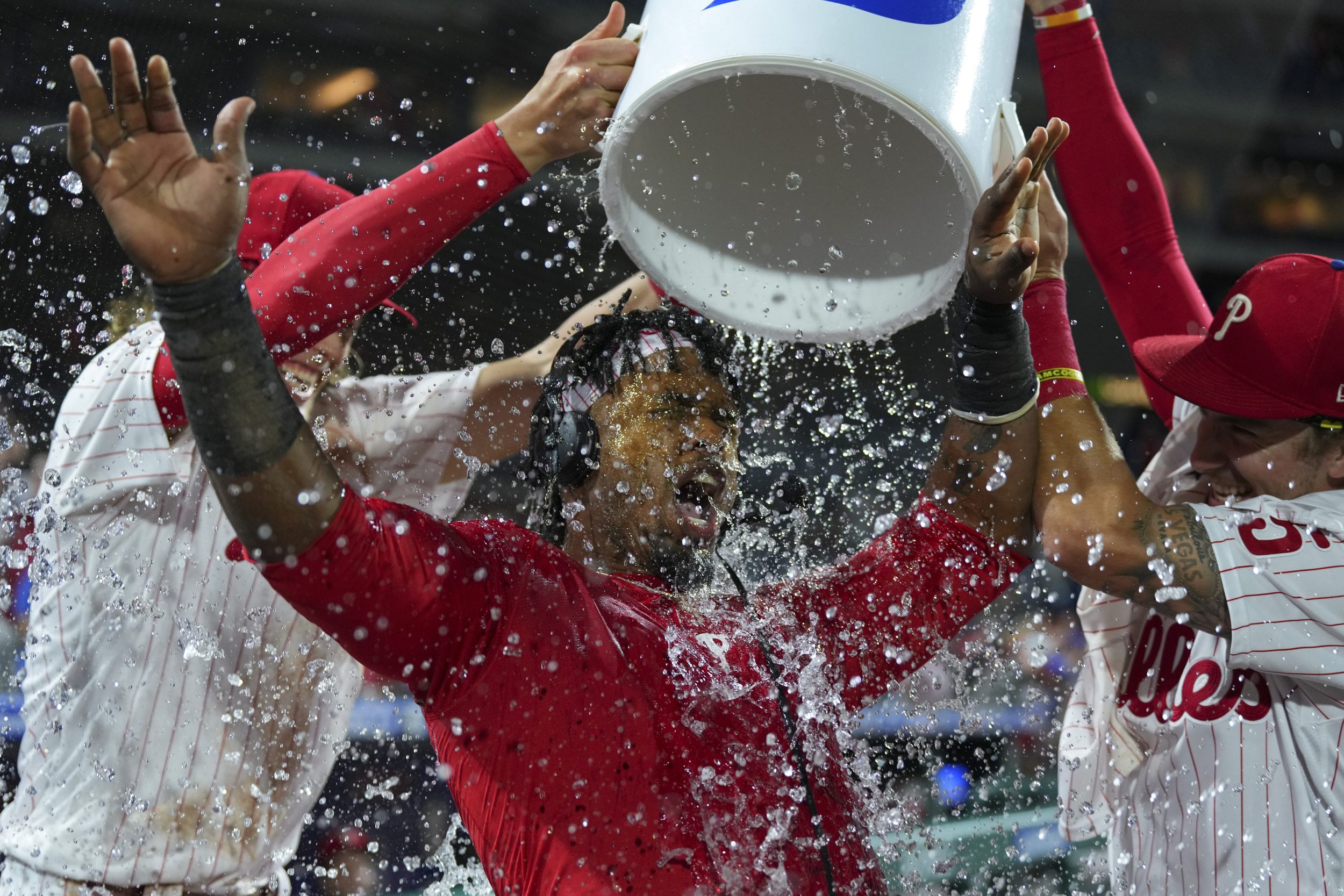 Jean Segura has water poured on him by his teammates